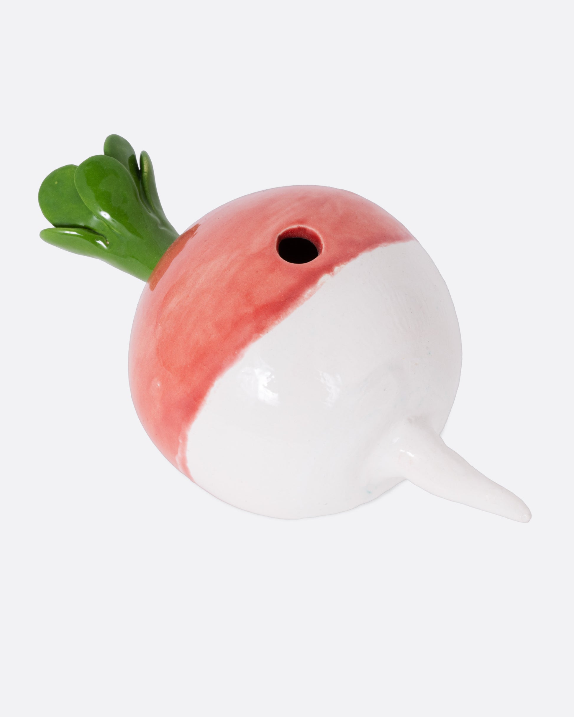 A ceramic radish candle  holder, shown from the top.