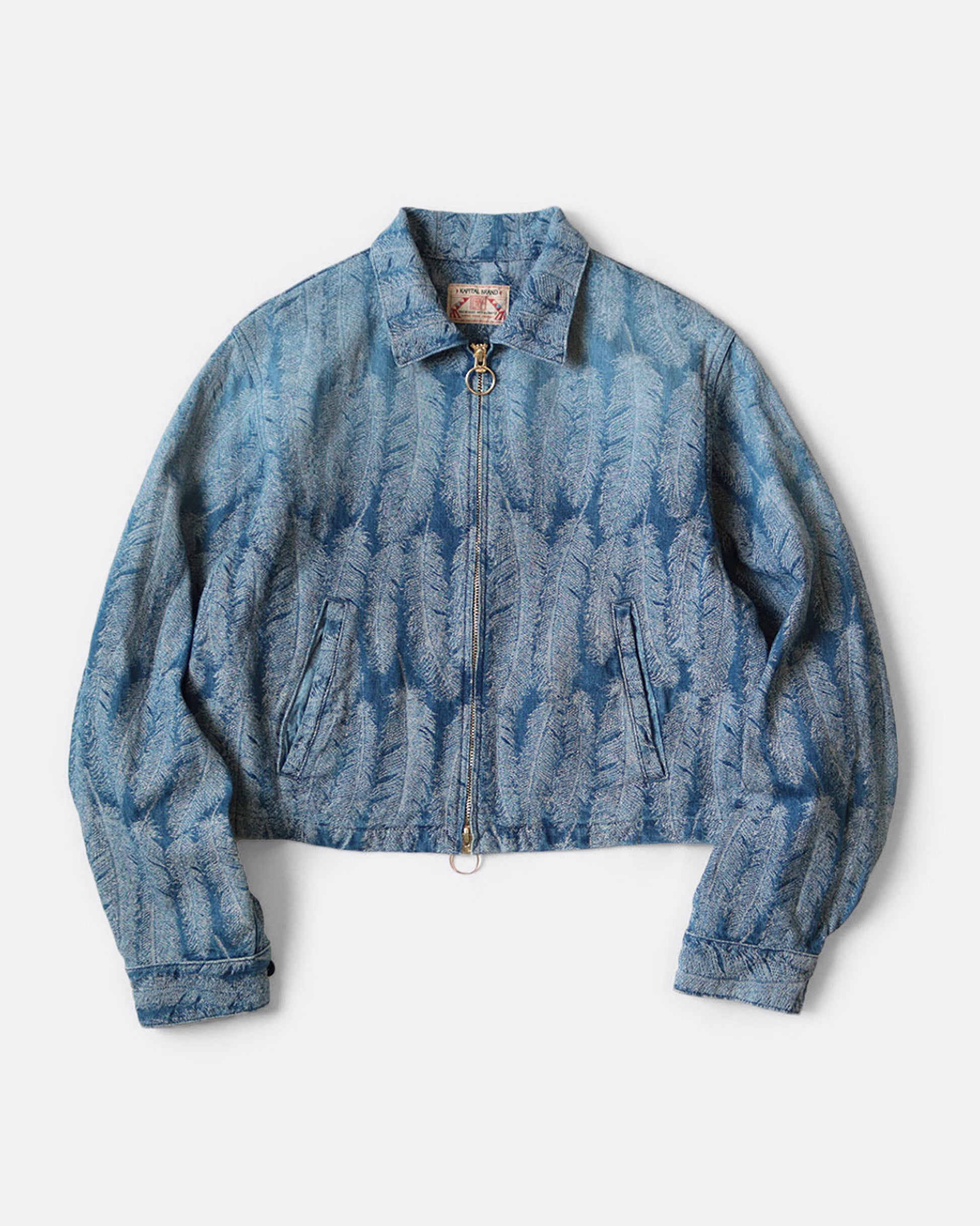 A light blue jacquard denim jacket with  an all- over feather motif, and a cut-off hemline with raw feathered seam. Shown from the front.
