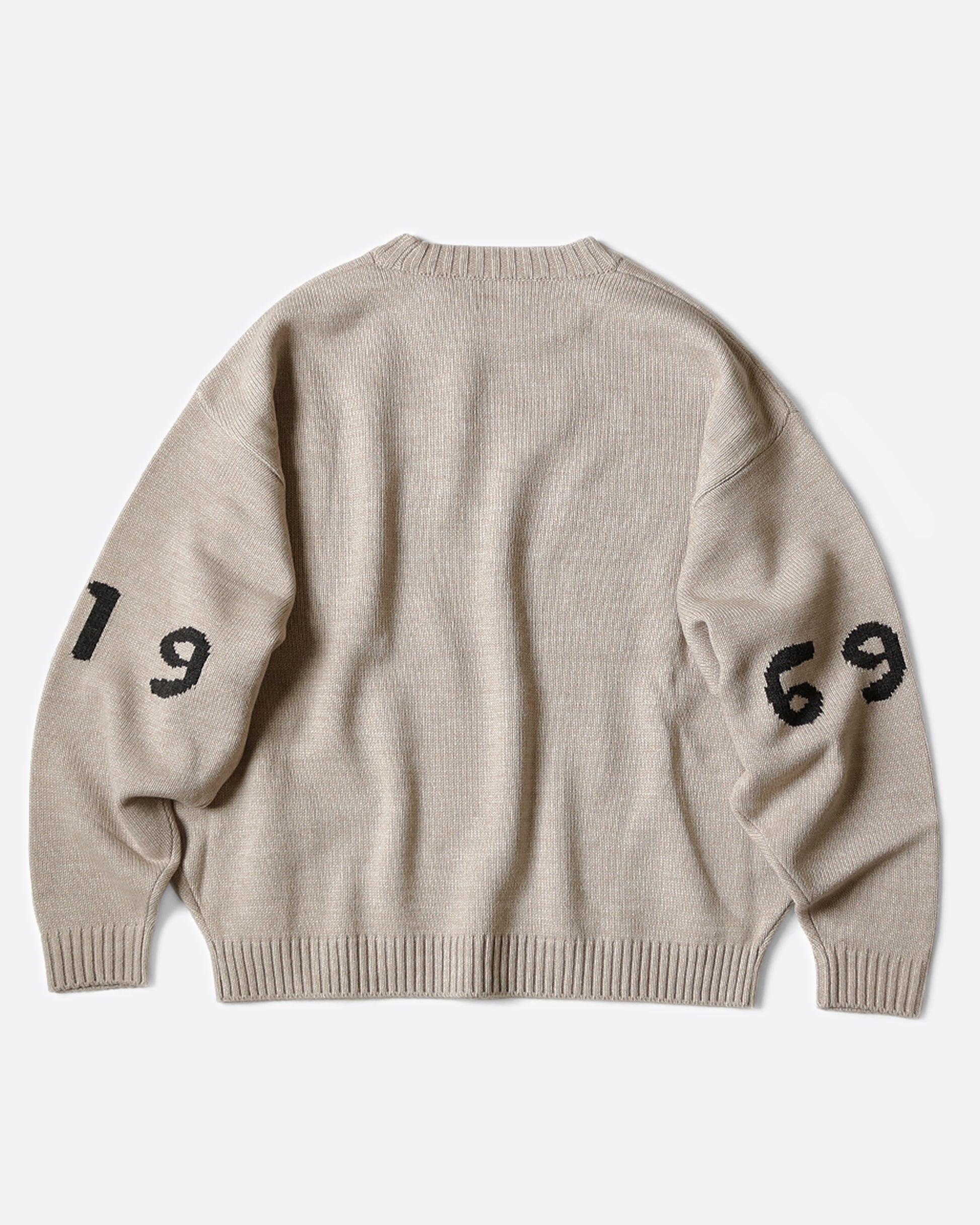 A 7g knit crewneck sweater with a design inspired by the Woodstock logo of 1969.