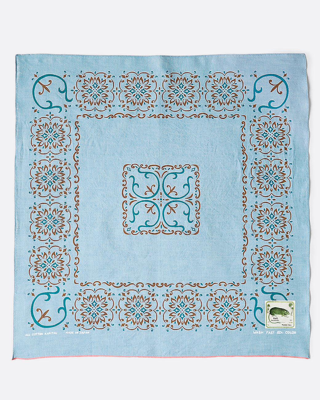 A light blue bandana with naja motif.