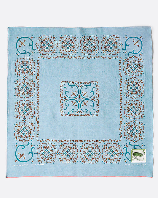 A light blue bandana with naja motif.