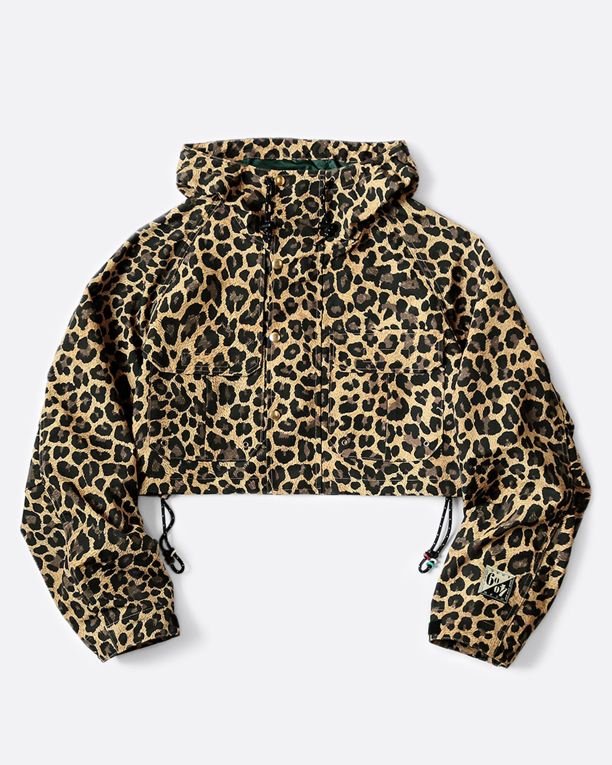 Cropped leopard rain jacket with hood and two front pockets. View from the front with hood down.