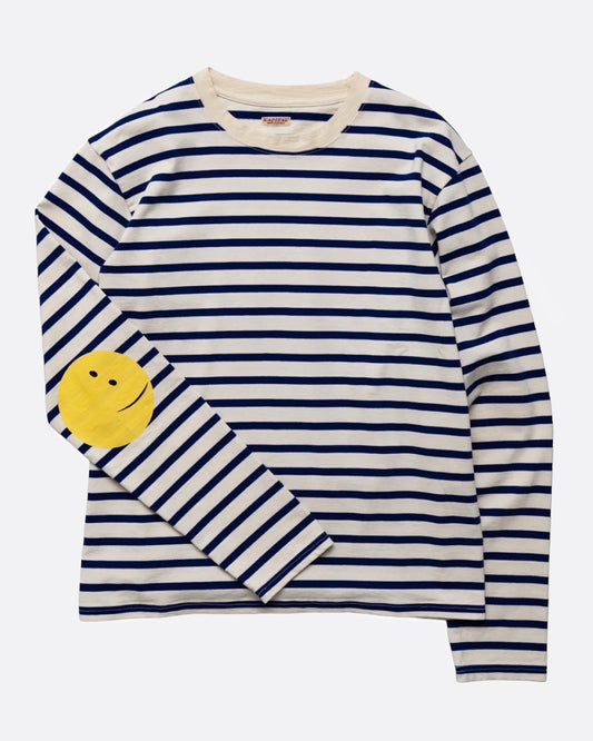 A blue and white striped, cotton, crewneck shirt with Kapital's fan favorite rainbow smiley elbow patches.