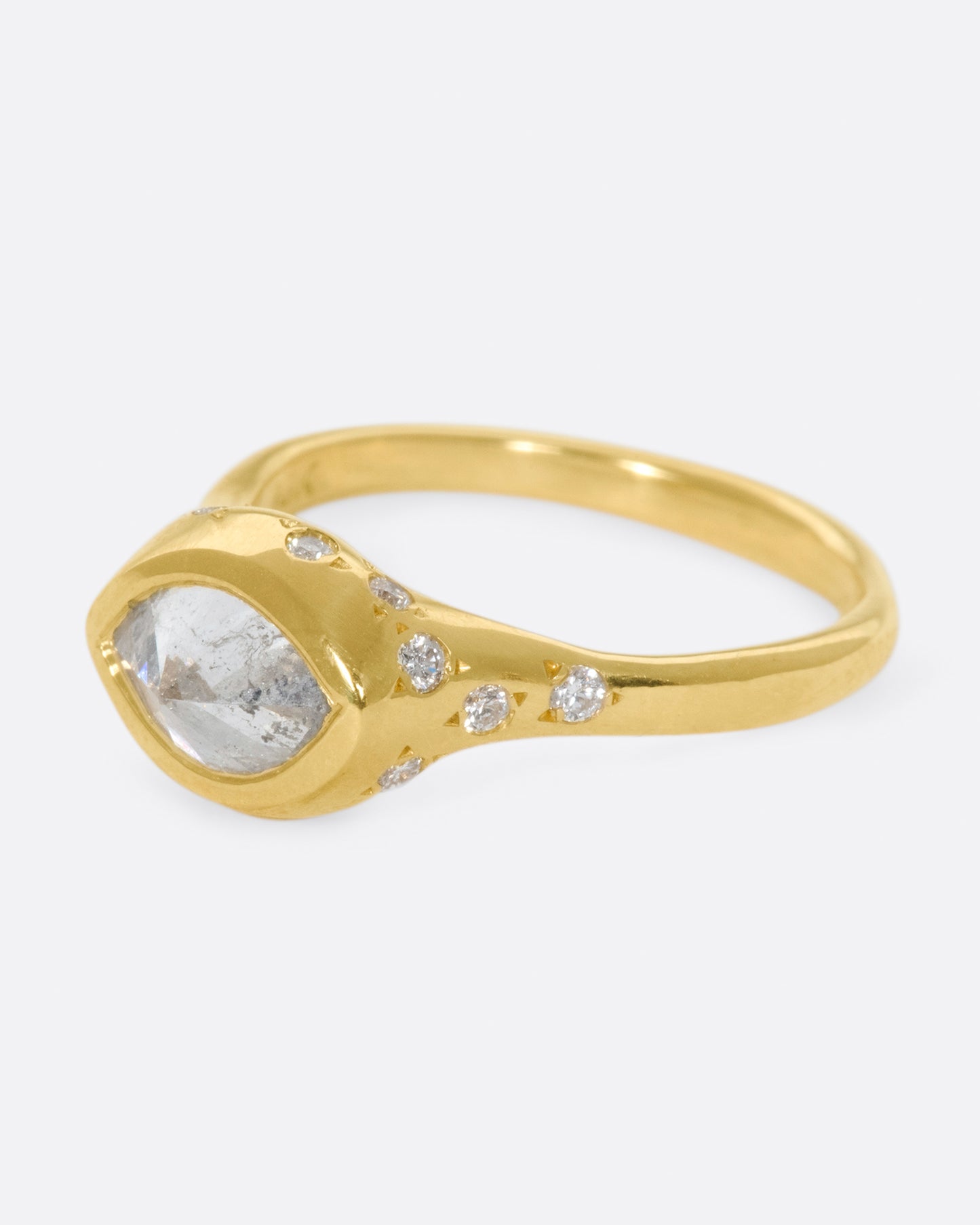 This ring is made extra special by the inverted, east-west diamond at its center.