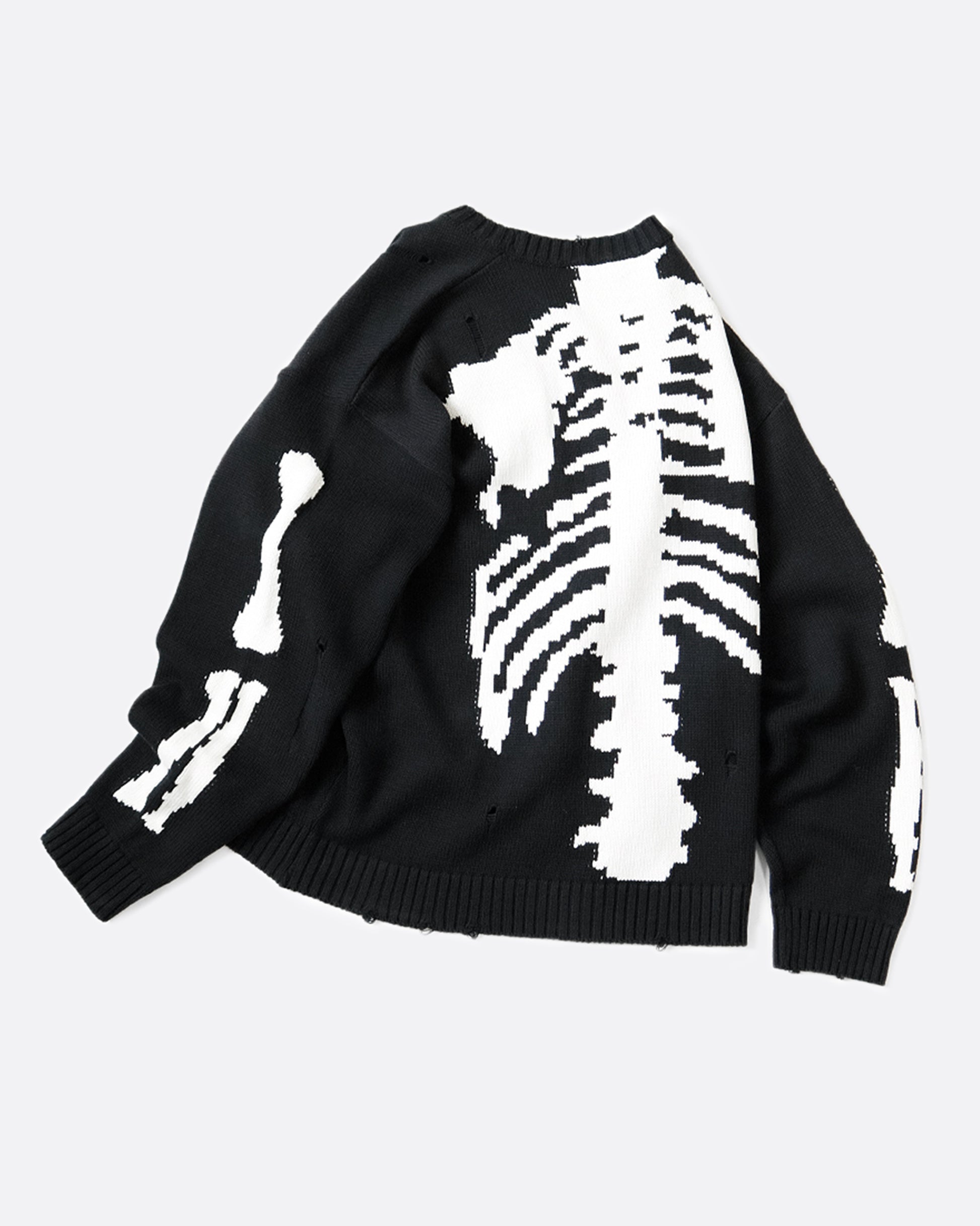 A distressed, black crewneck sweater with Kapital's beloved bone design on the back and sleeves.