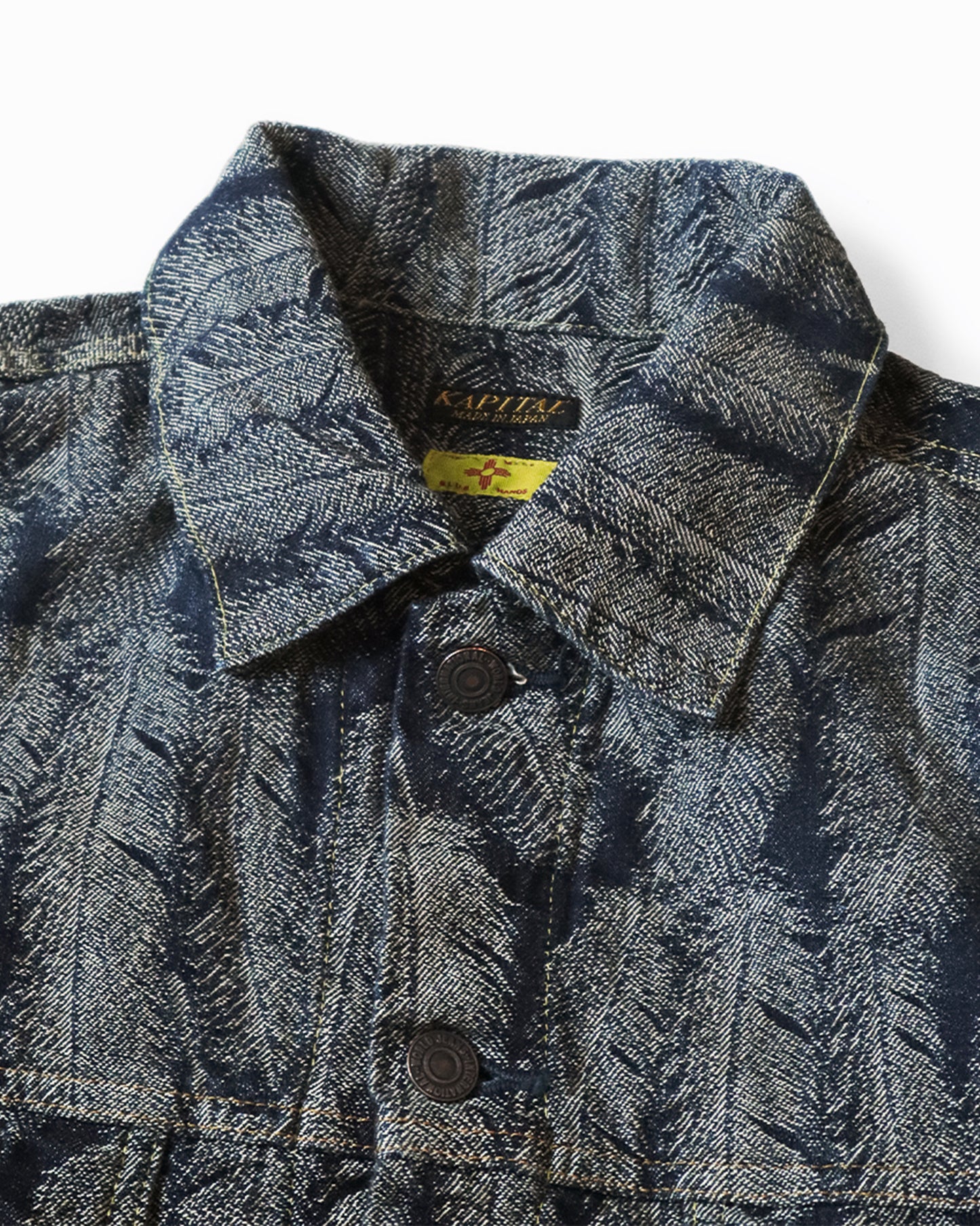 A Type III jacket made from denim jacquard with a 3D luxurious feather pattern and a fringy hem.