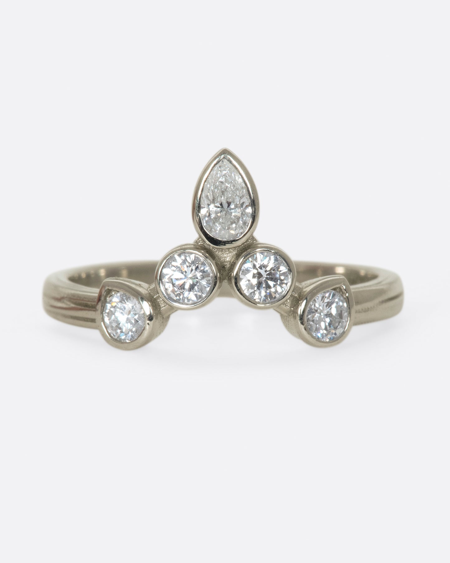 This crowning design can be worn in either direction on the finger, alone, or stacked with another one of Karen's creations - We love it with one of her Invincible Heart rings