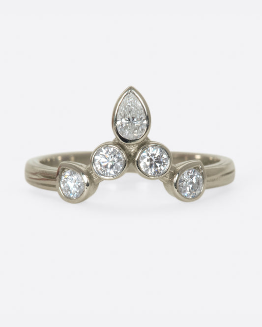 This crowning design can be worn in either direction on the finger, alone, or stacked with another one of Karen's creations - We love it with one of her Invincible Heart rings