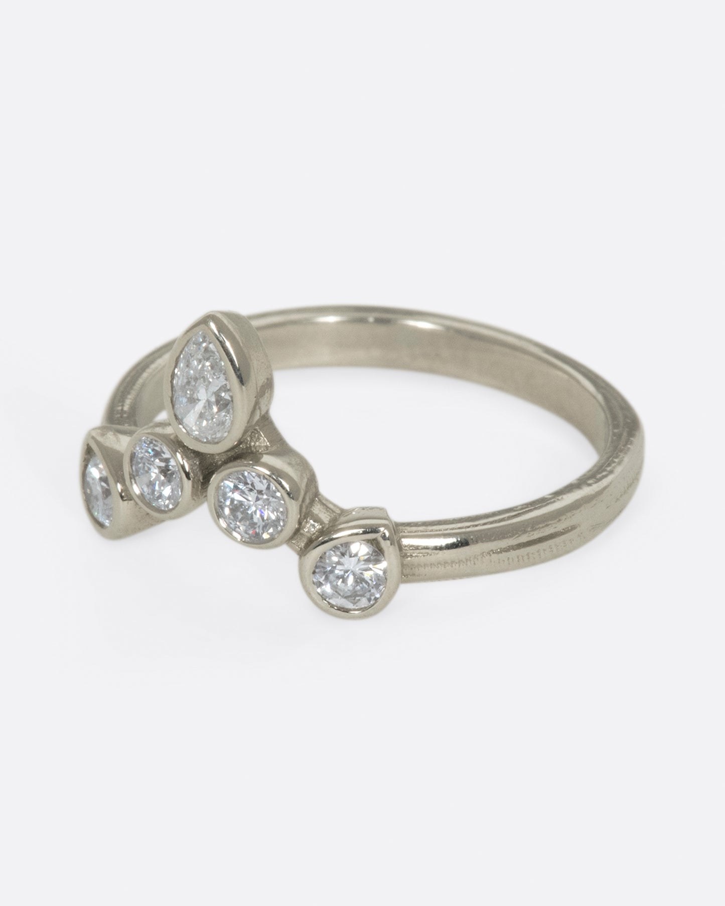 This crowning design can be worn in either direction on the finger, alone, or stacked with another one of Karen's creations - We love it with one of her Invincible Heart rings