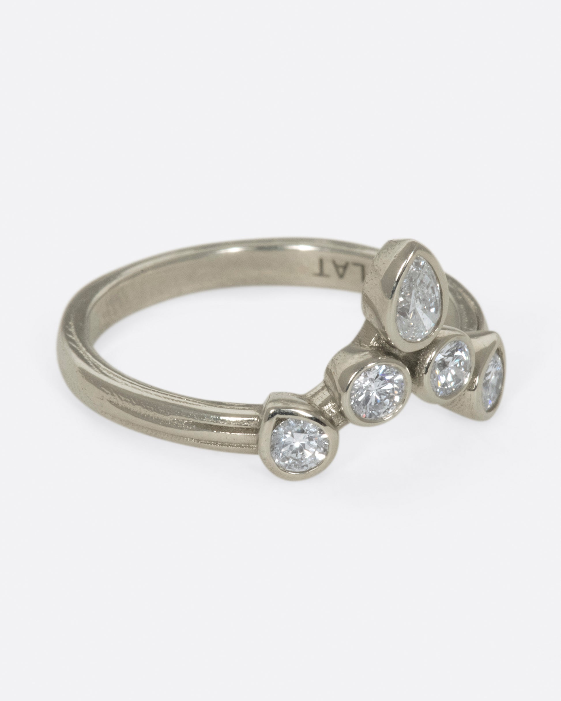 This crowning design can be worn in either direction on the finger, alone, or stacked with another one of Karen's creations - We love it with one of her Invincible Heart rings