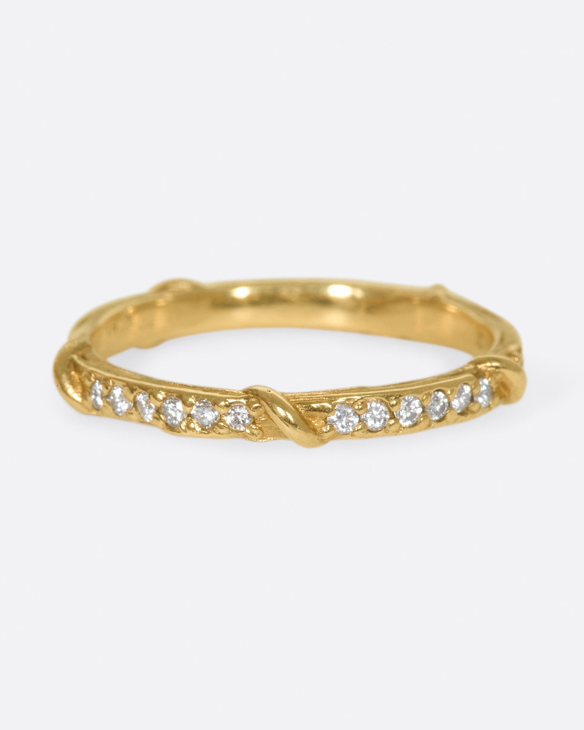 Studded halfway around with diamonds, this band is a twist on a classic with an organic edge.