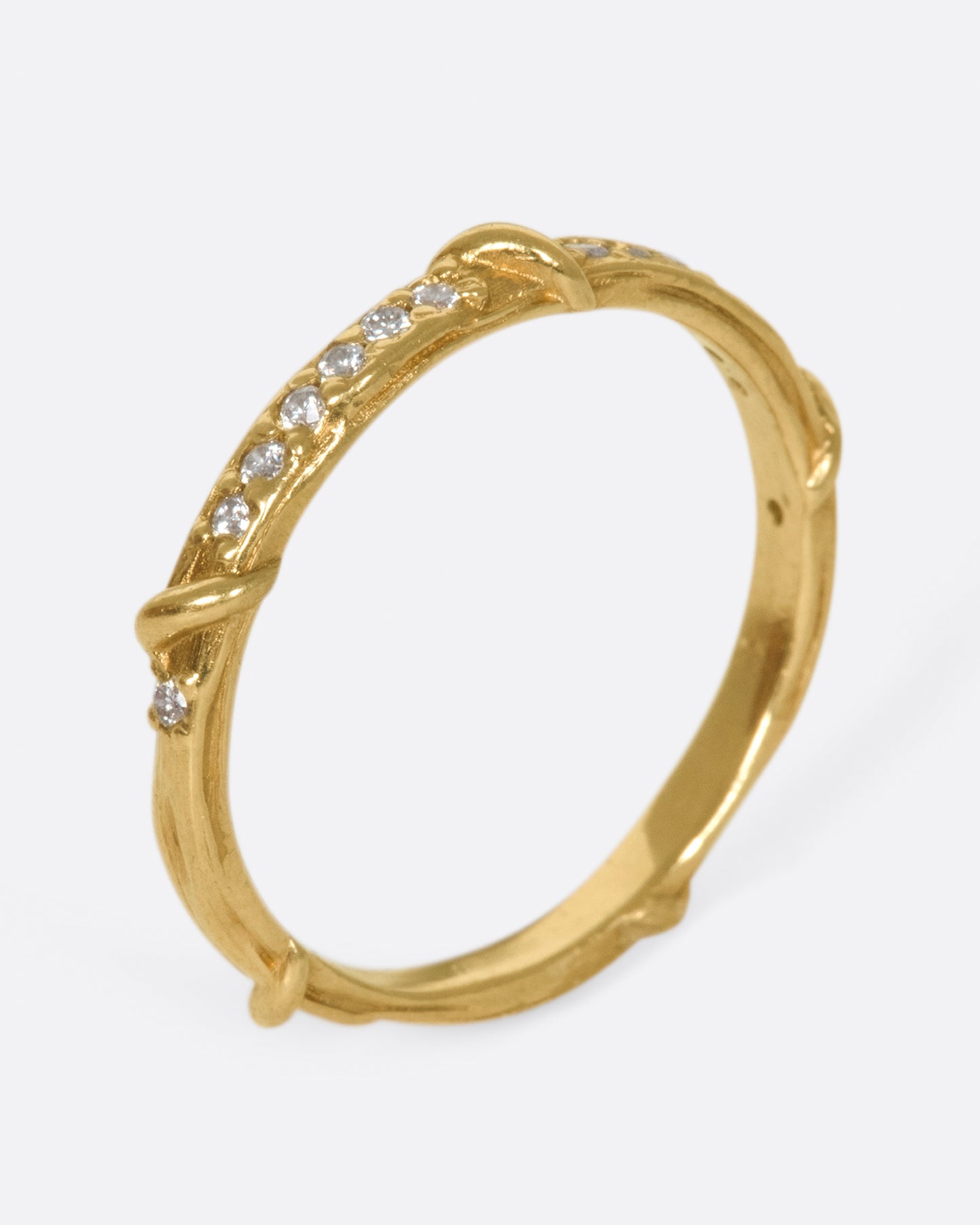 Studded halfway around with diamonds, this band is a twist on a classic with an organic edge.