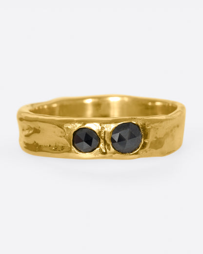 Karen Karch Together band in yellow gold, a textured organic band set flush with two rose-cut black diamonds