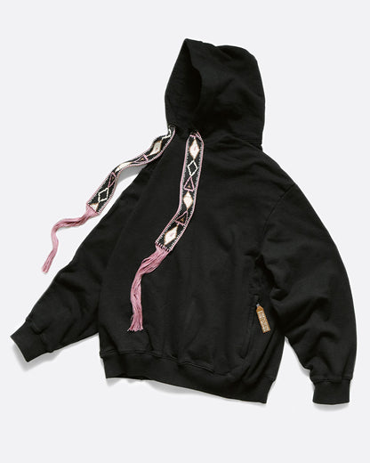 Kapital Big Maldives knit hooded sweatshirt in black, with woven geometric drawstrings ending in long pink tassels