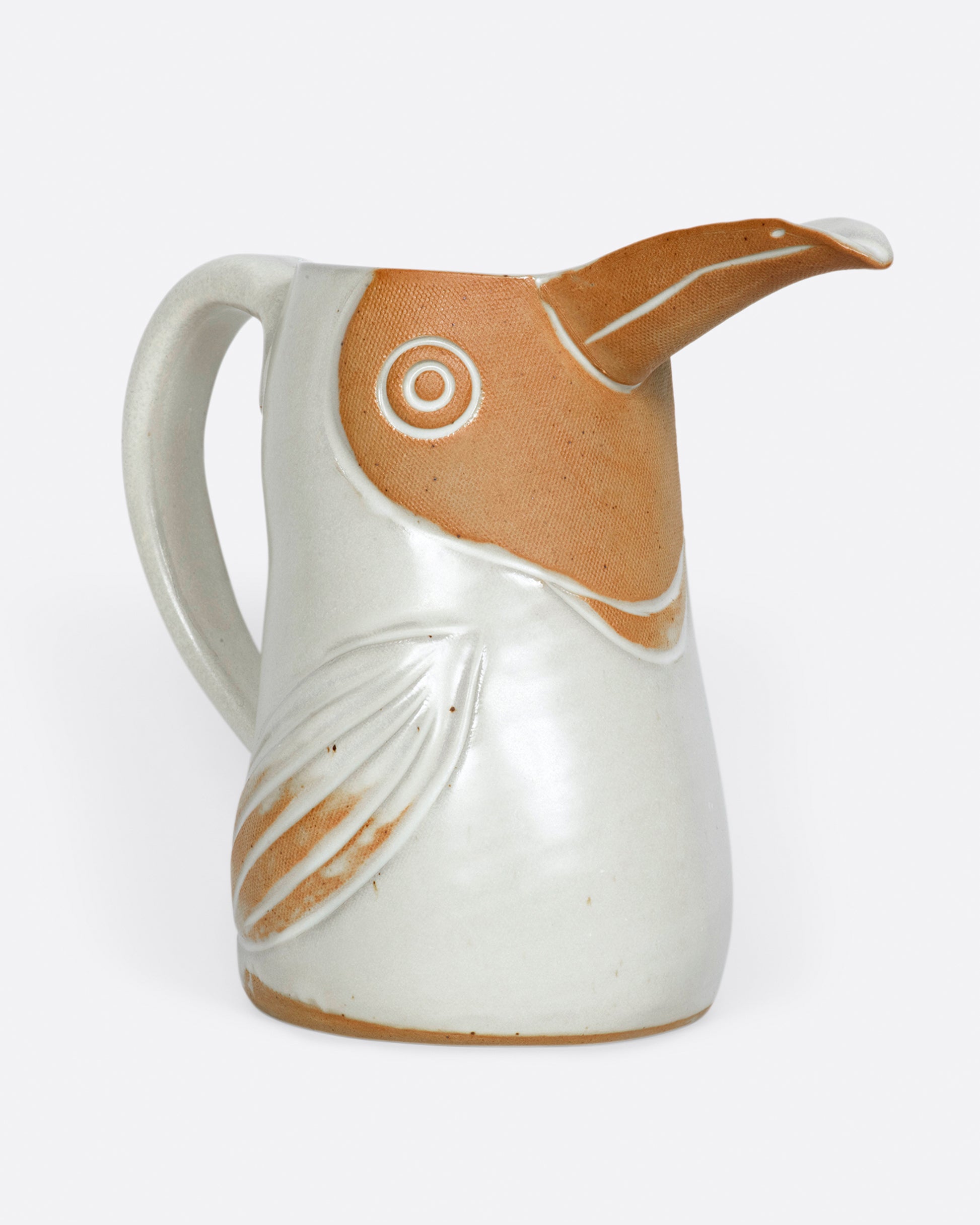 A ceramic pitcher to hold your favorite beverage or flowers.