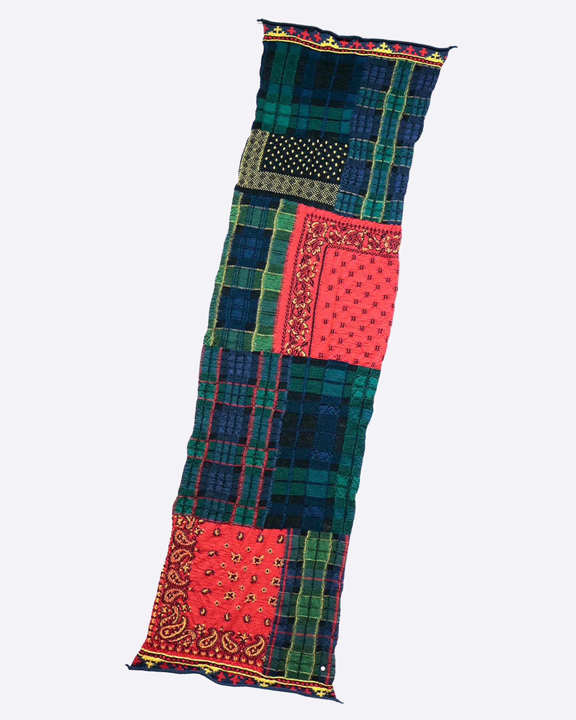 A fluffy wool patchwork scarf that combines different tartan checks and bandana patterns.