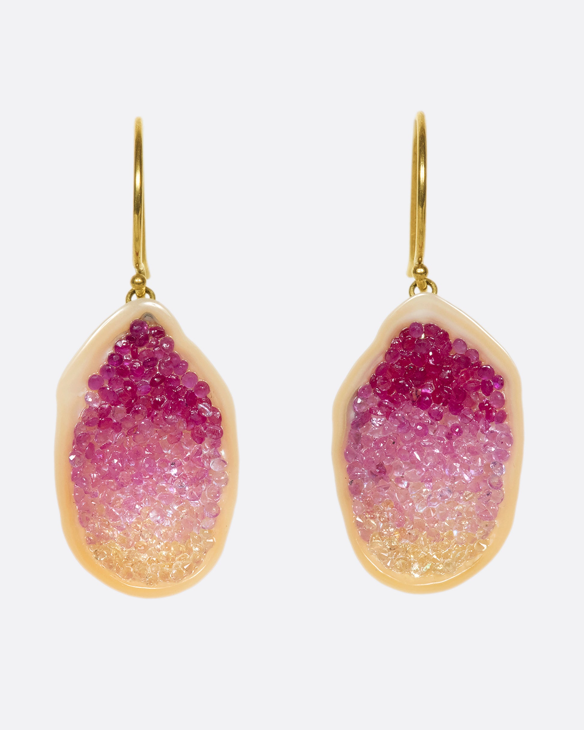 The smooth, soft pearls are lined with reclaimed pink and yellow ombre sapphires