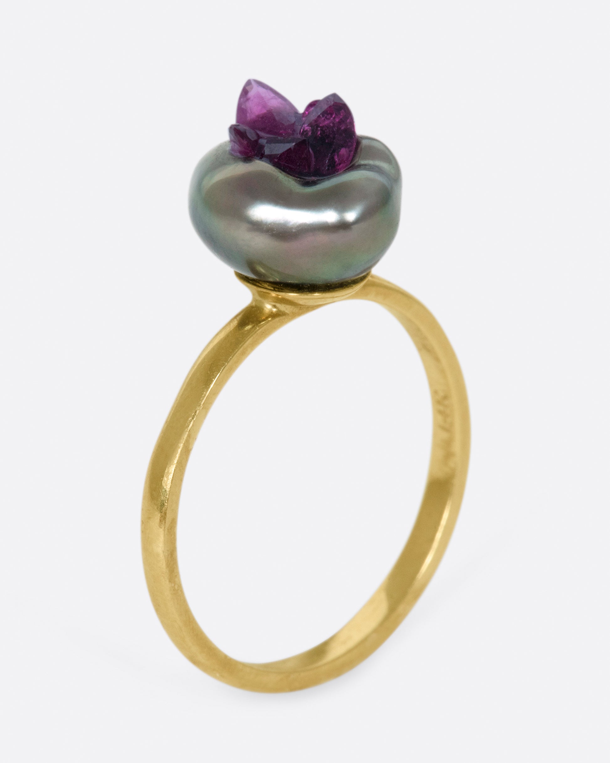 Yellow gold freshwater pearl ring lined with reclaimed rubies. View from the side standing up.