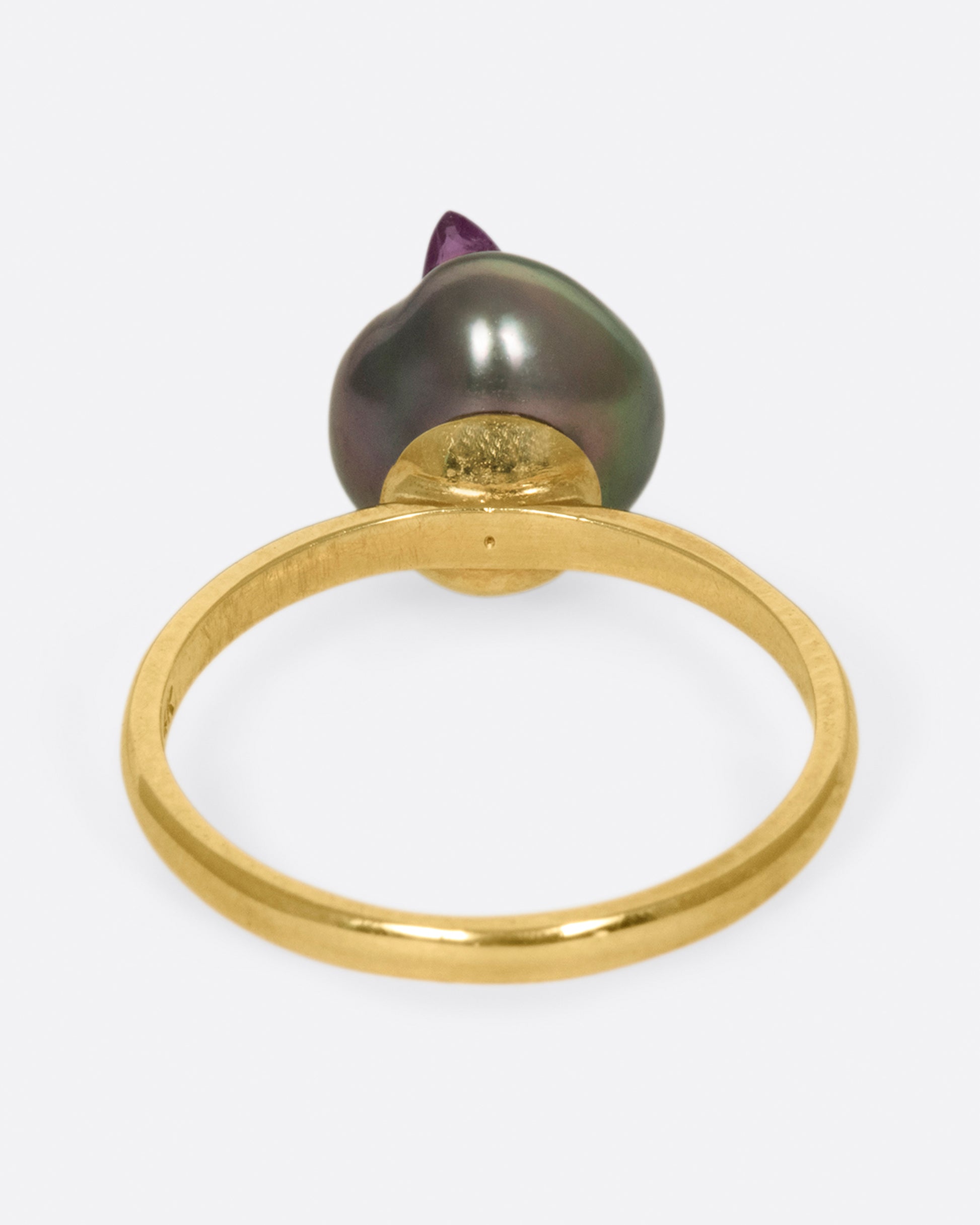 Yellow gold freshwater pearl ring lined with reclaimed rubies. View from the back.