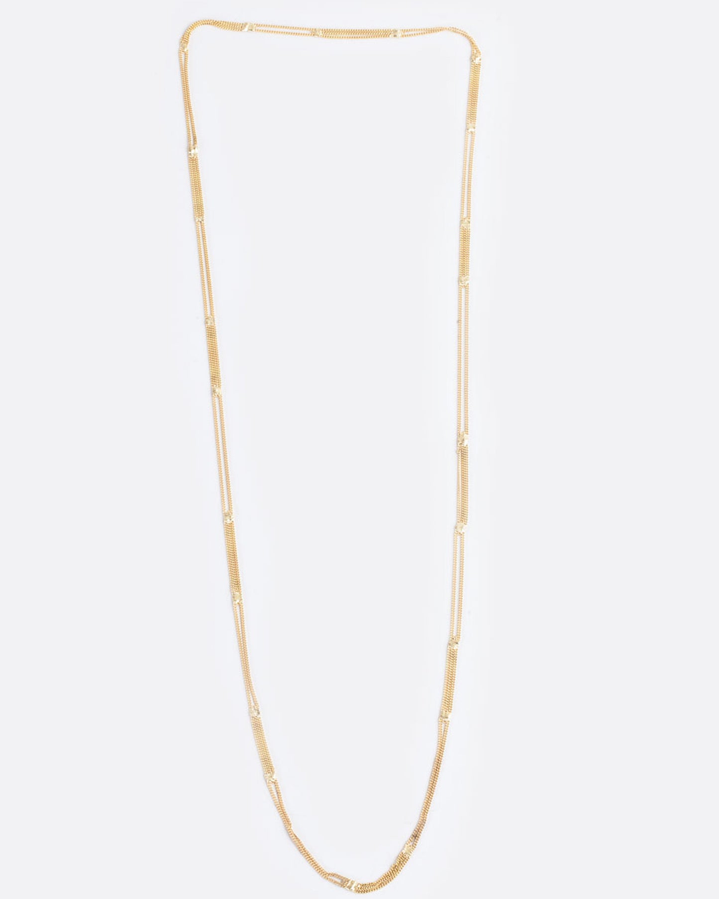 A long yellow gold multi chain necklace with alternating pattern of squares finished with gold solder.