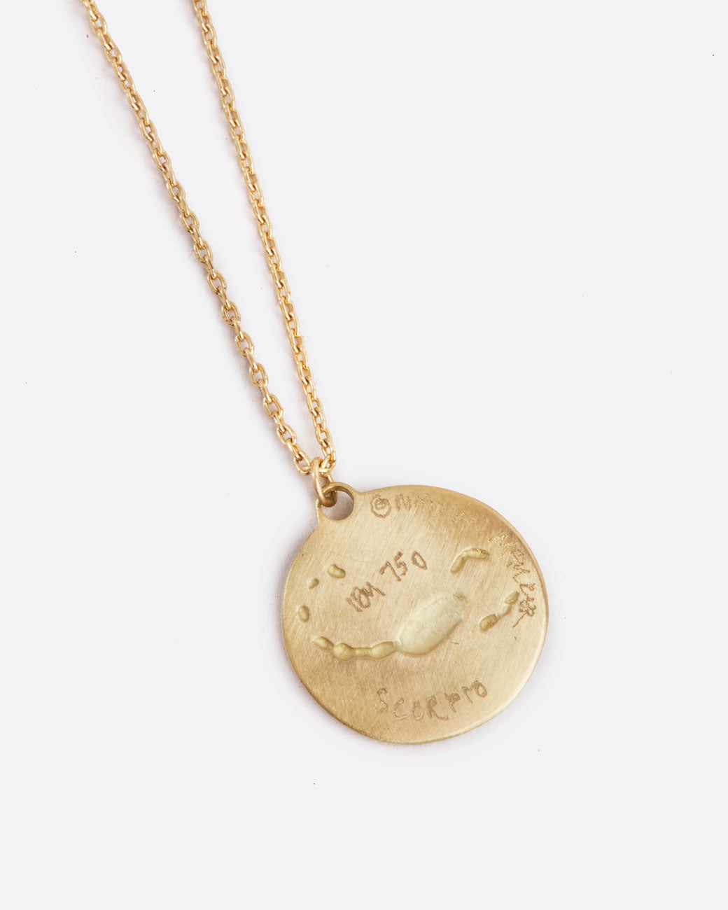 A yellow gold necklace with a round pendant with your choice of zodiac symbol.