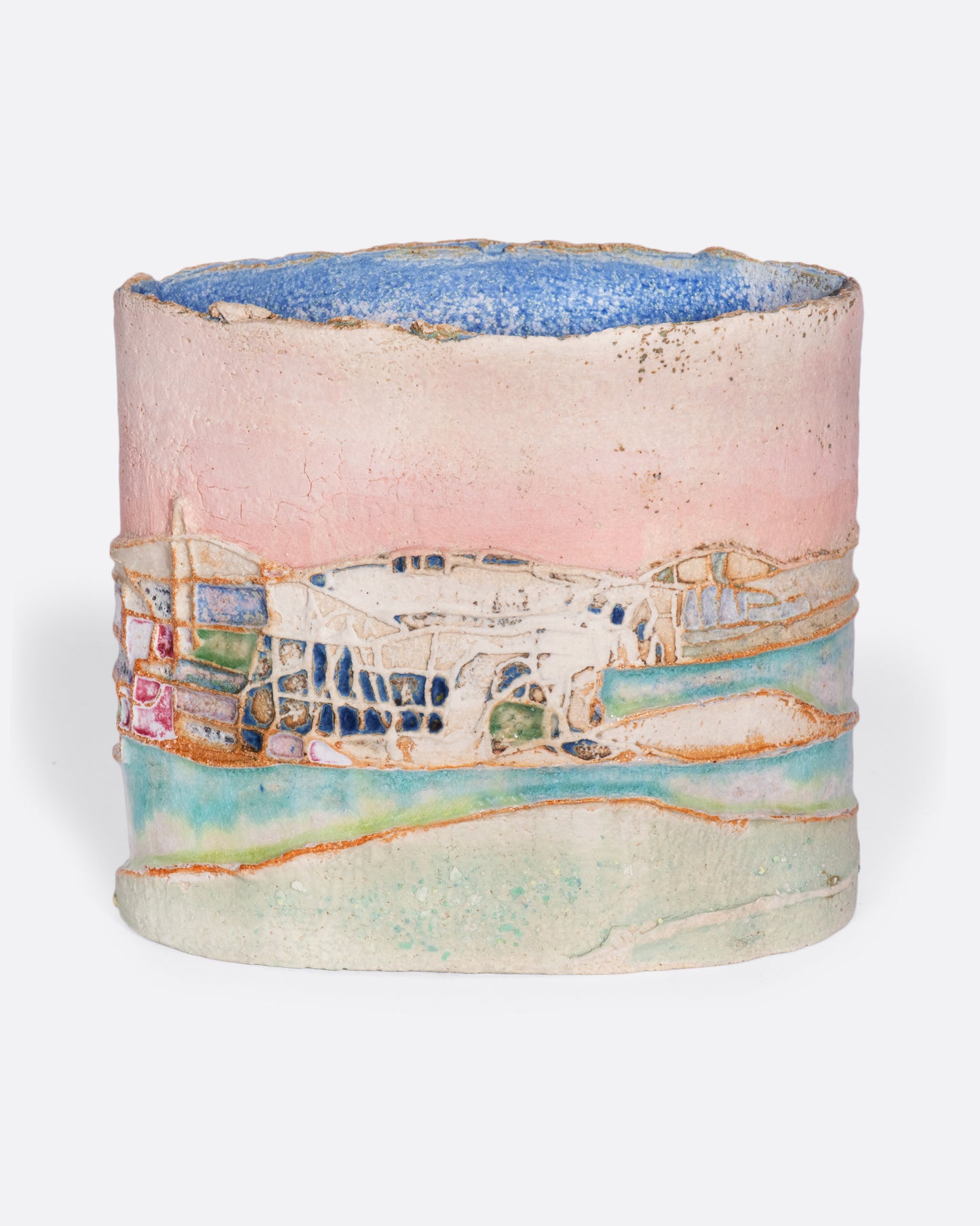 This ceramic vessel is meticulously handmade with many layers of glaze atop stoneware clay, creating a rich, varied texture. A truly special piece that transports you to golden hour in southern France