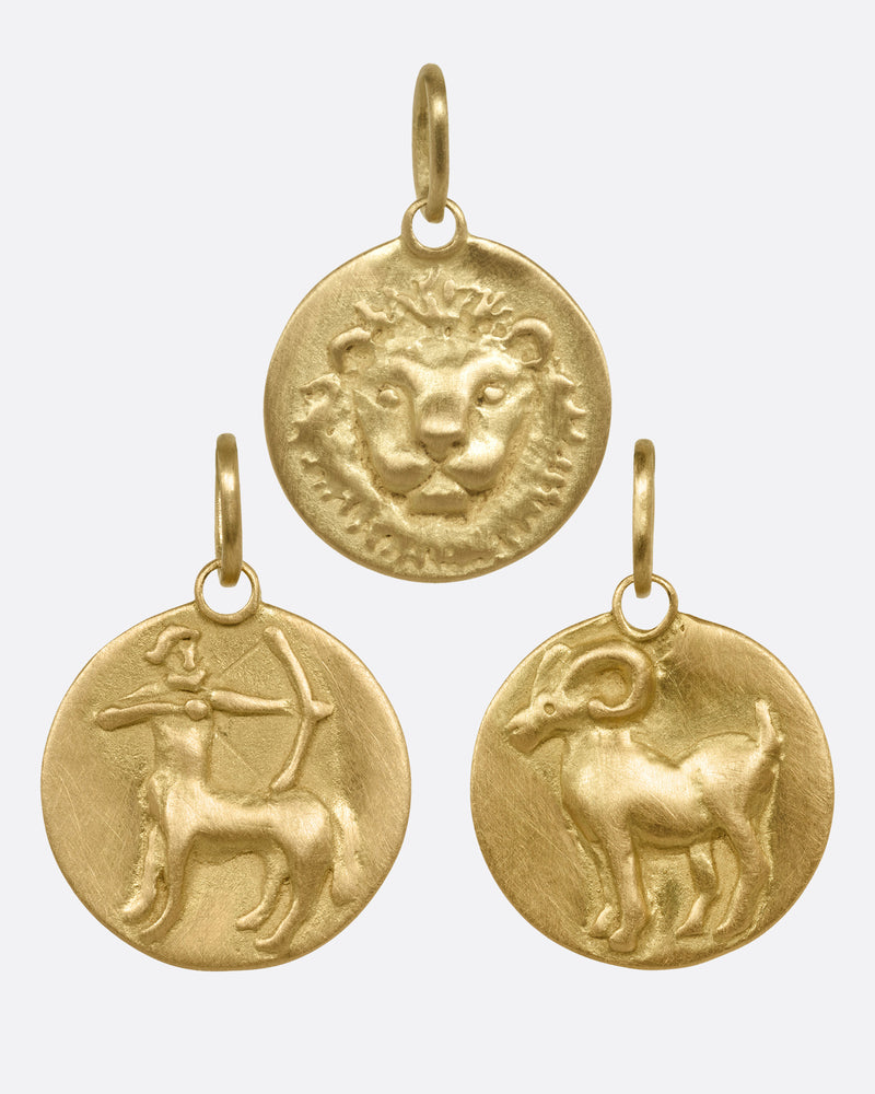 Marian Maurer Fire astrological medals in 18k yellow gold, three round charms for Leo, Sagittarius and Aries