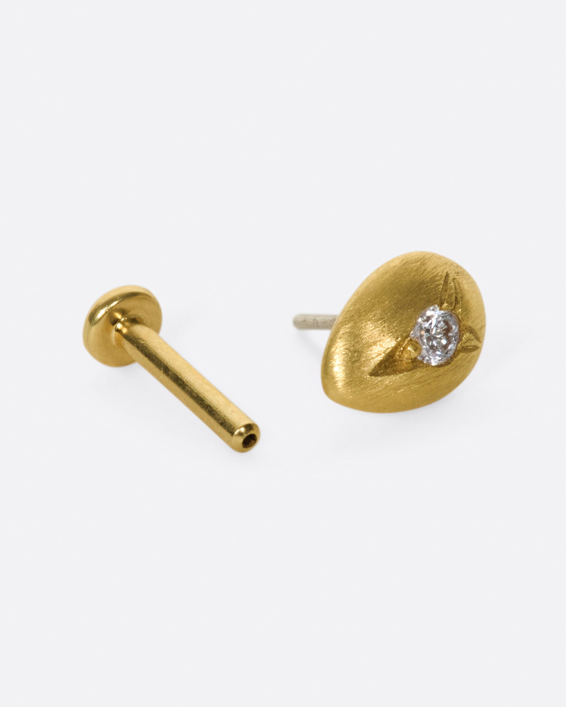 This brushed gold earring is smooth and rounded like a real drop of water.