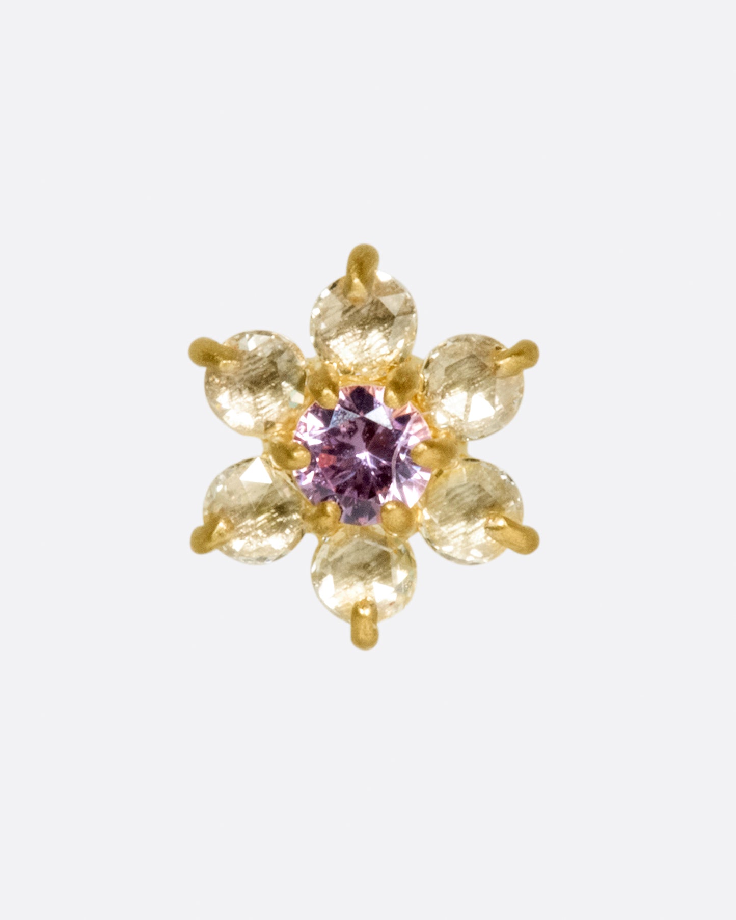 A yellow gold threadless earring front made from 6 white diamond and one pink sapphire in the shape of a flower.