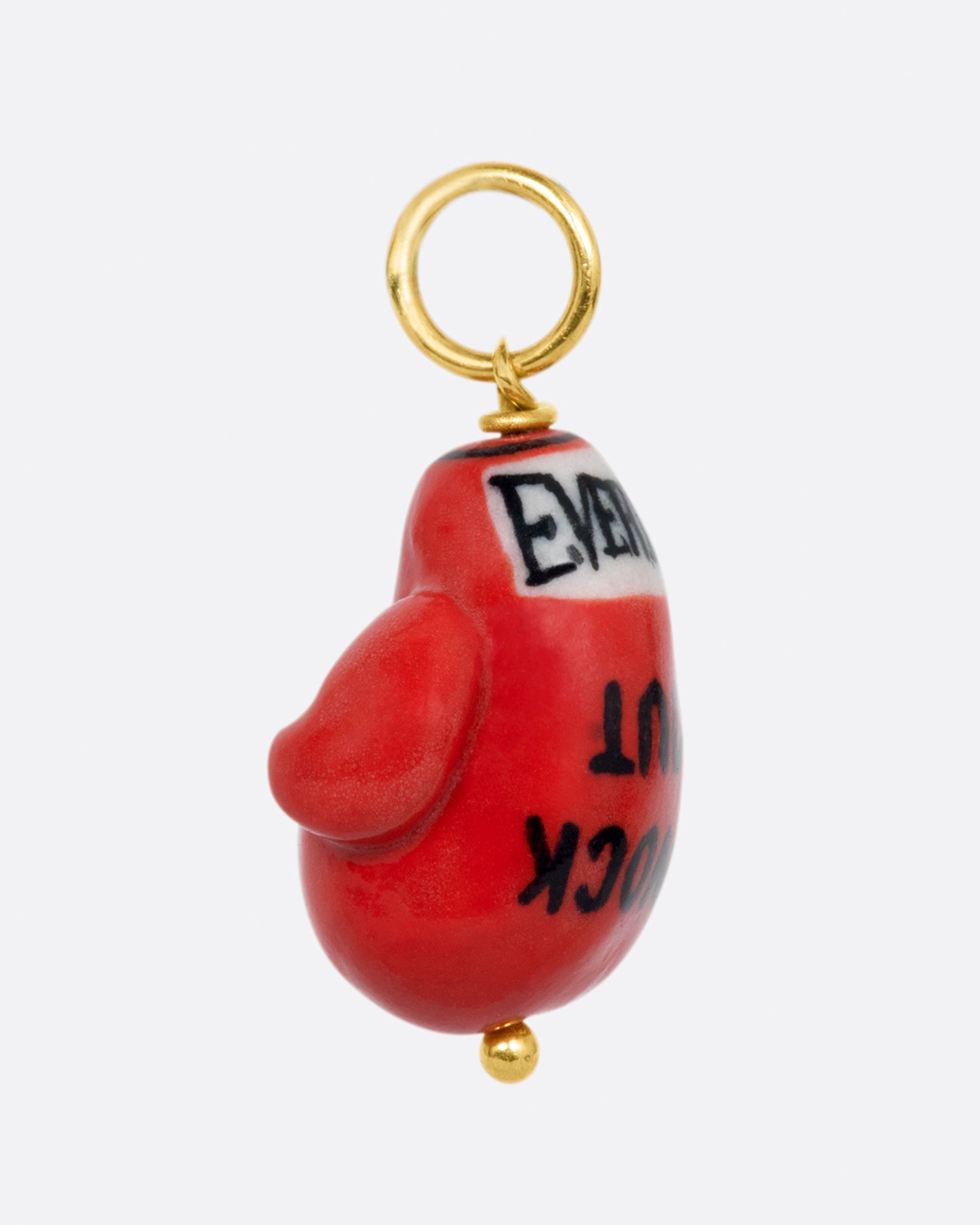 A handmade porcelain red Everlasting boxing glove charm with the words "Knock out" written on it, with a yellow gold bail.