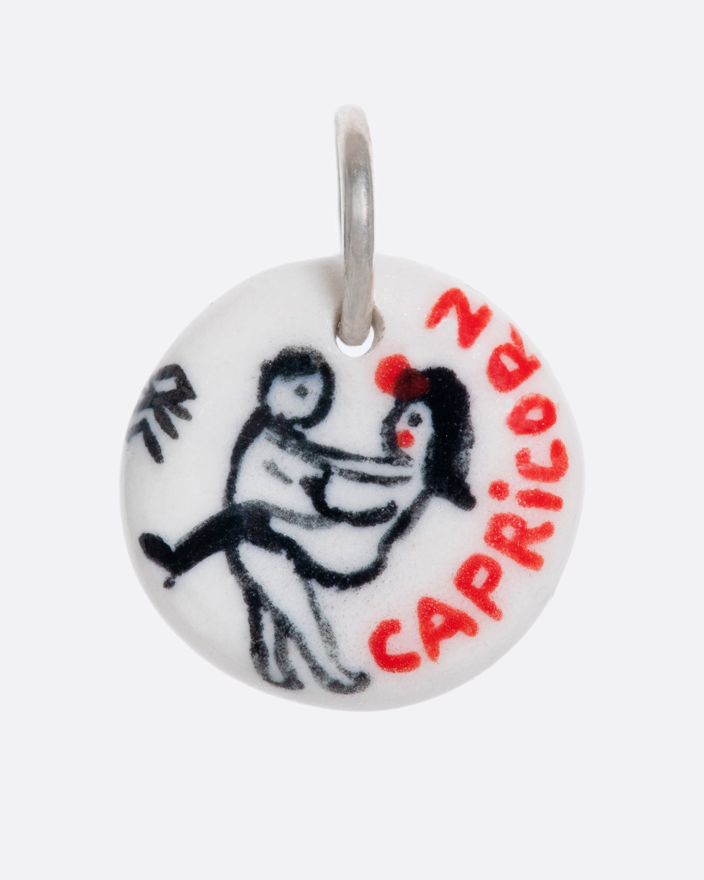 A handmade and painted porcelain zodiac disc charm with a sterling silver bail, featuring a sex position specific to each zodiac.