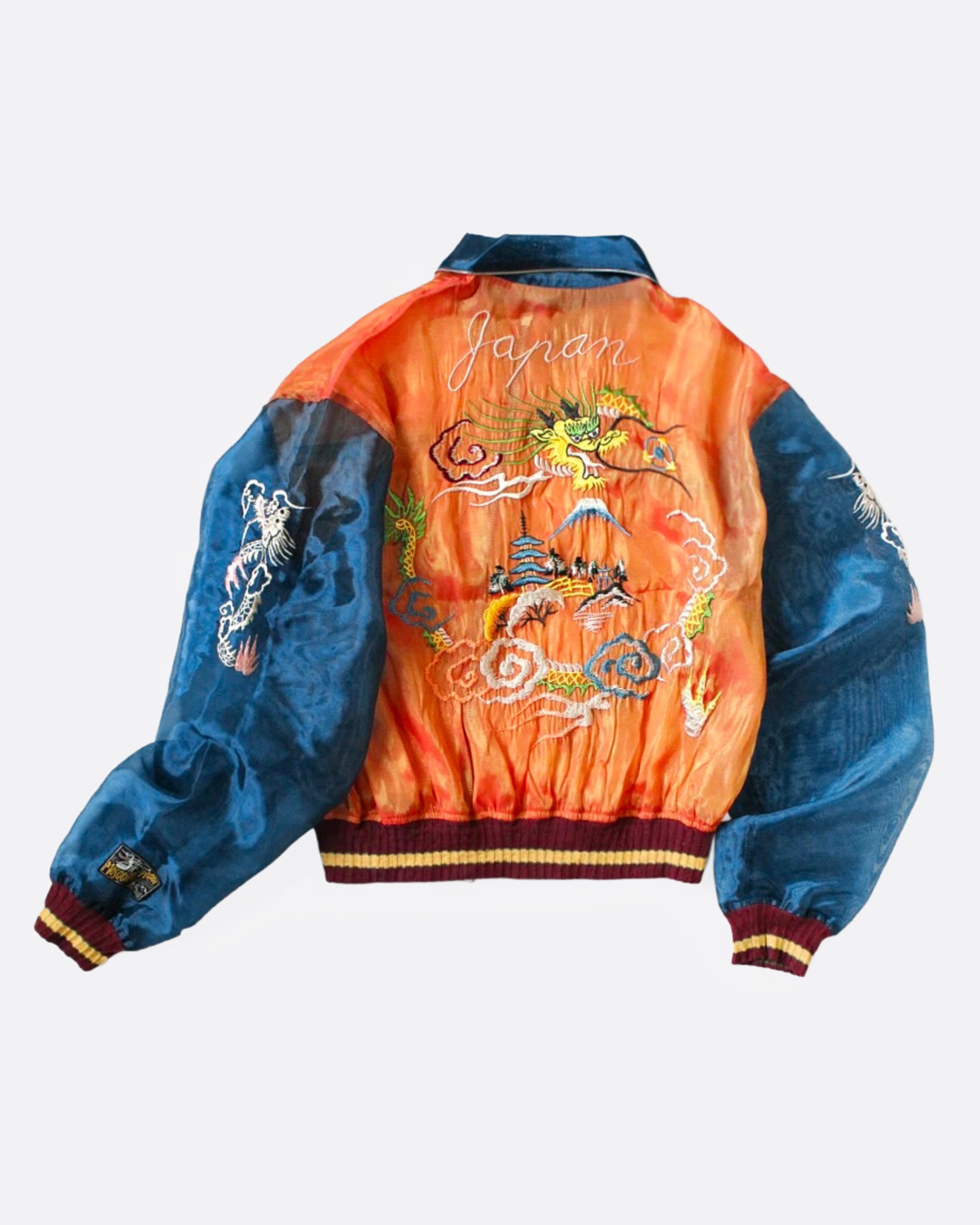 An orange and blue sheer bomber jacket with dragon embroidery, shown from the back.
