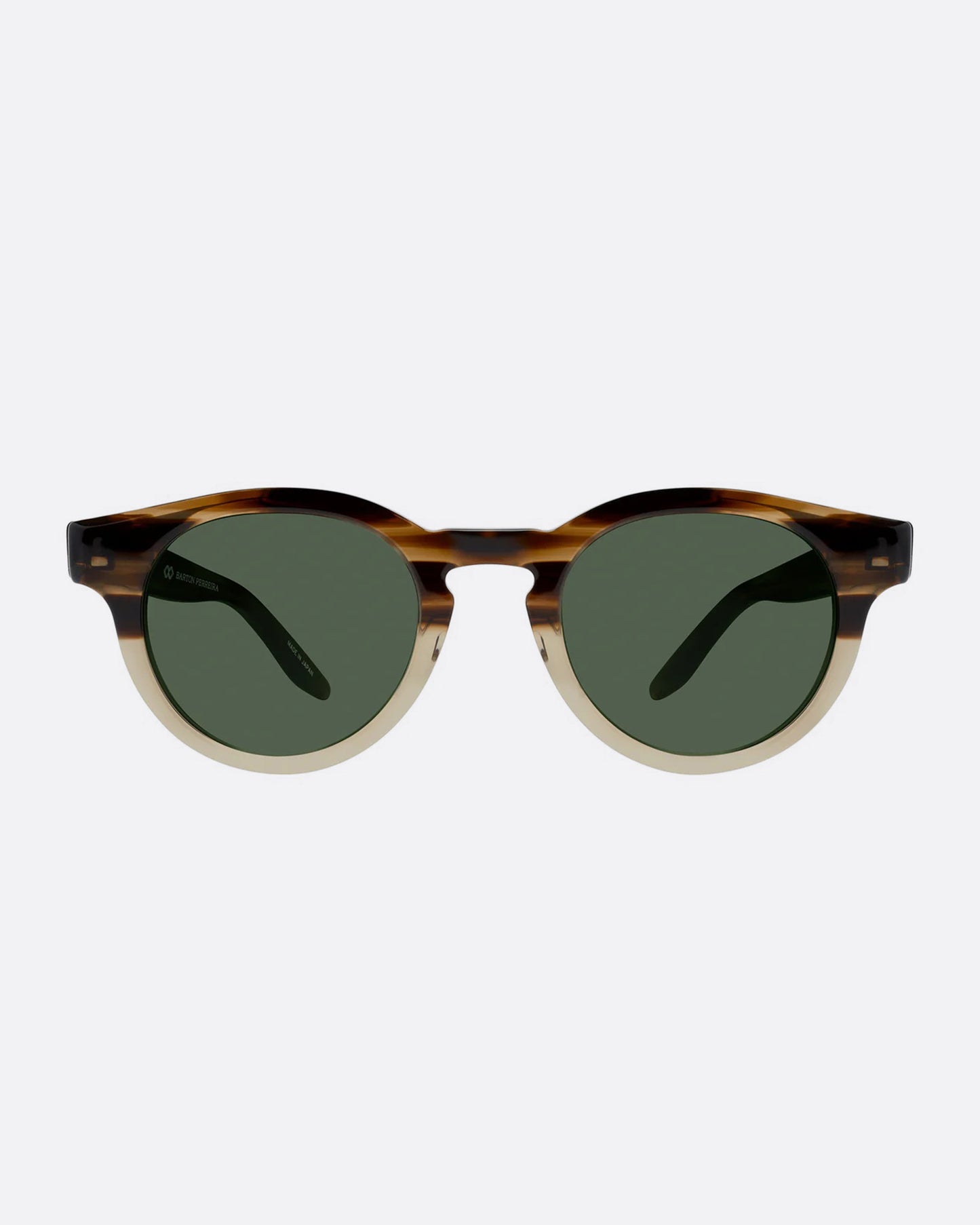 A round pair of sunglasses with frames that are brown on top and tan on the bottom. The lenses are dark green. Shown from the front.  