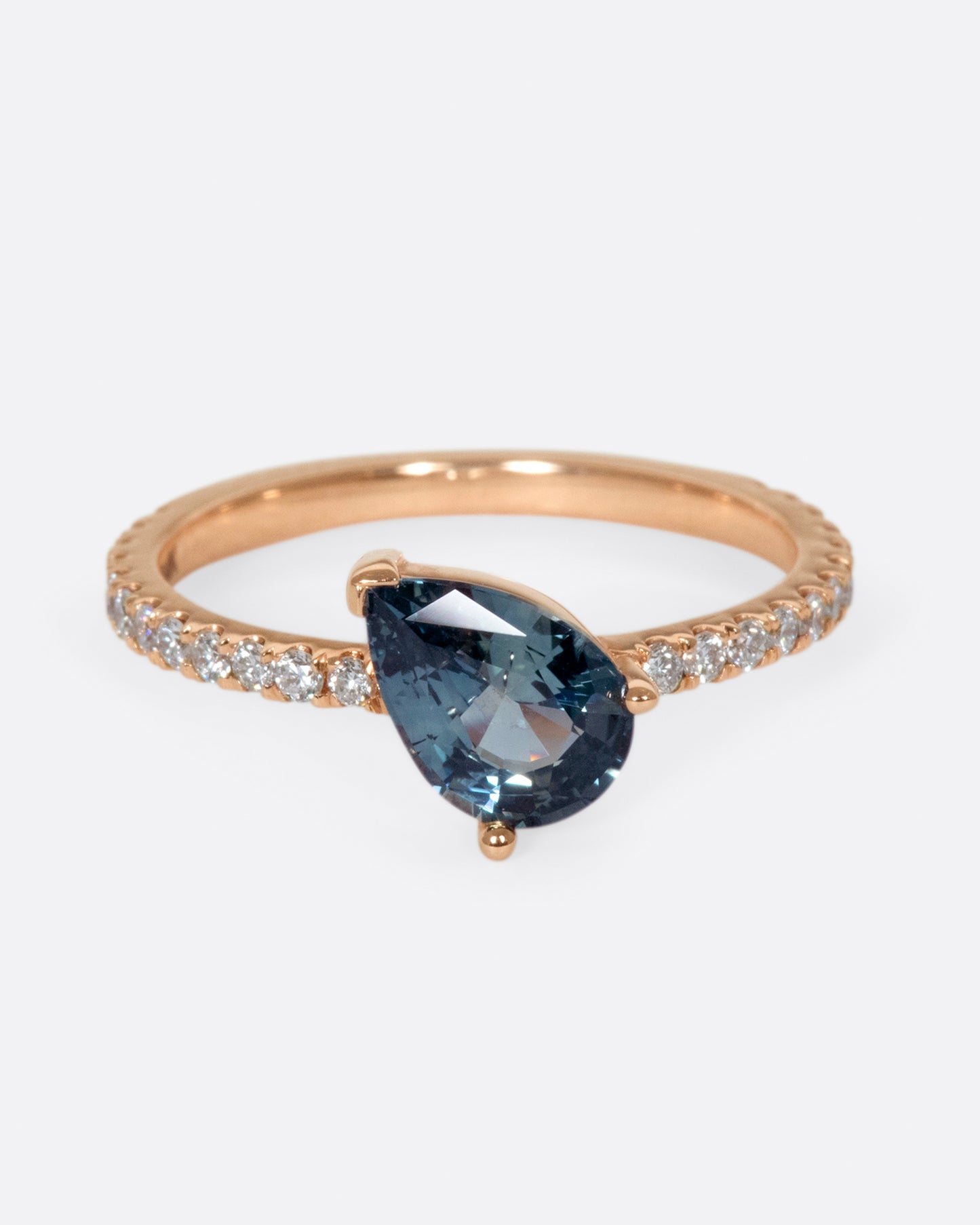 The saturated blue-green sapphire is the star of this ring.