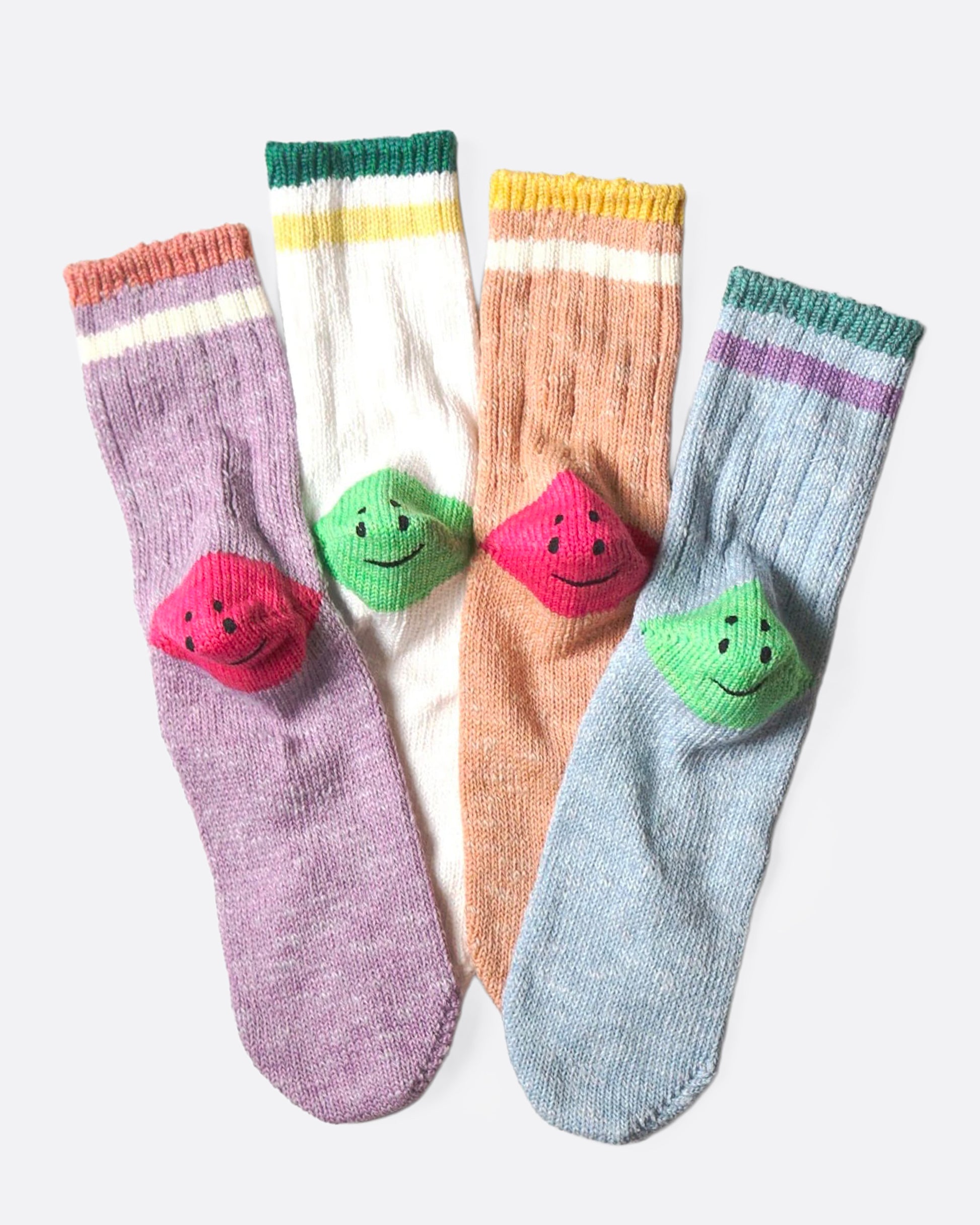 Four colorful socks with smiley faces on the heels, shown from the back.