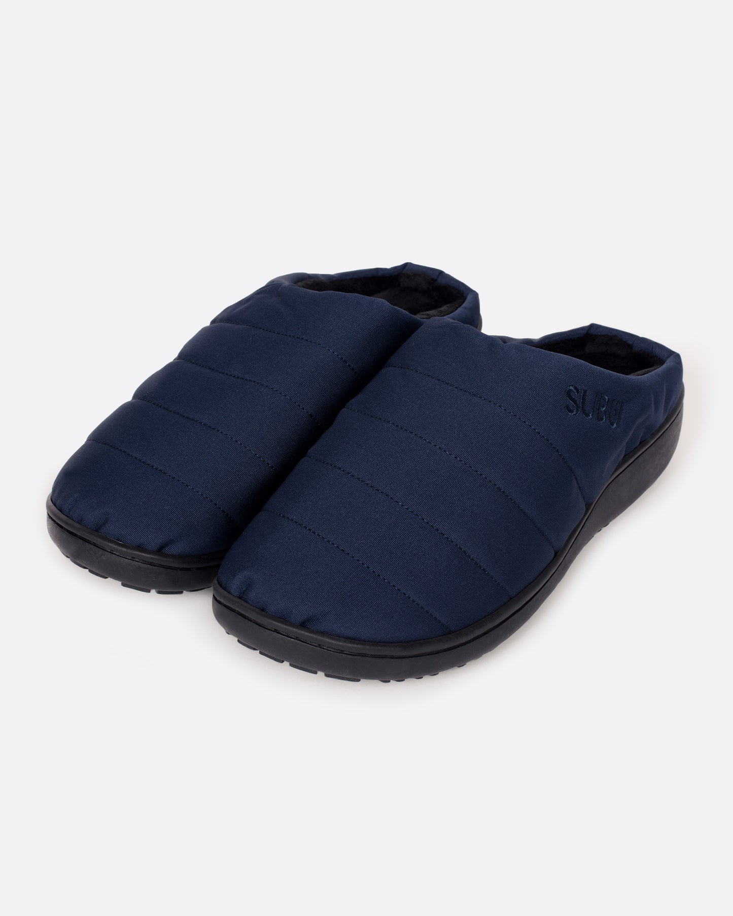 A pair of navy nylon slippers with black rubber soles, shown from the side.