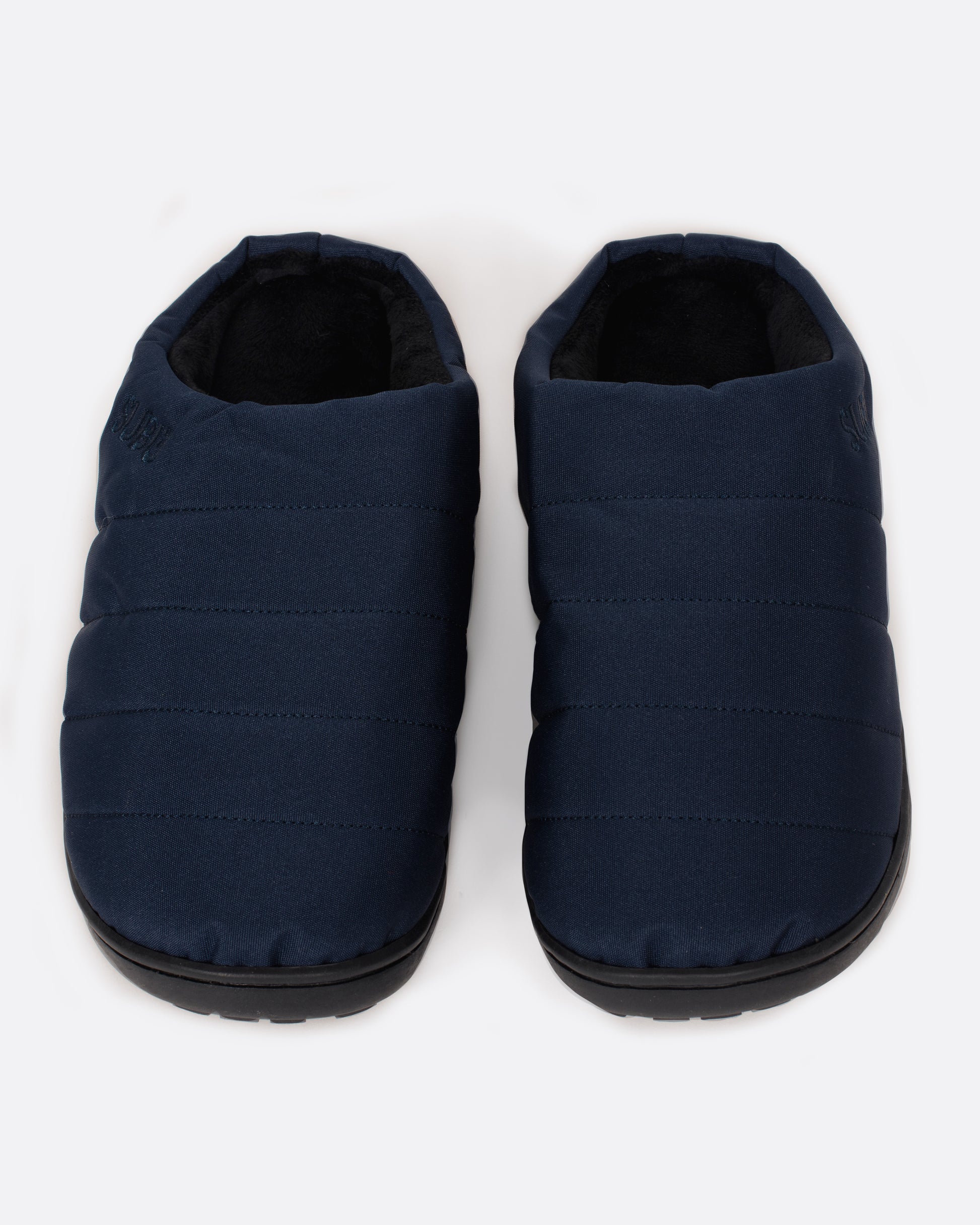 A pair of navy nylon slippers with black rubber soles, shown from the front.