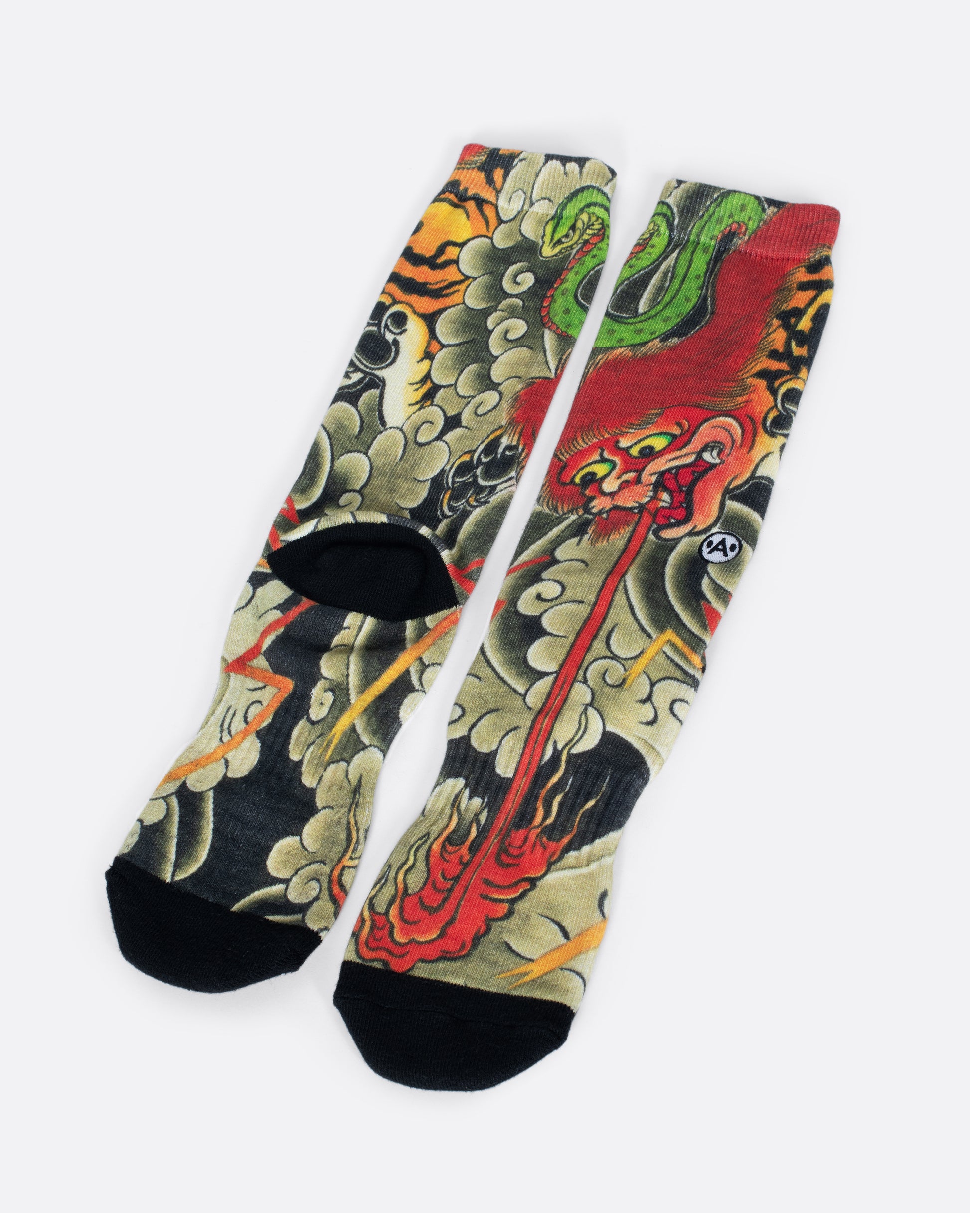 Socks with dragon spitting fire surrounded by smoke clouds. View from the front and alternating back, revealing the dragons paws and claws as well as the face of a green snake.