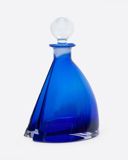 Vintage cobalt blue glass decanter with a clear round glass stopper