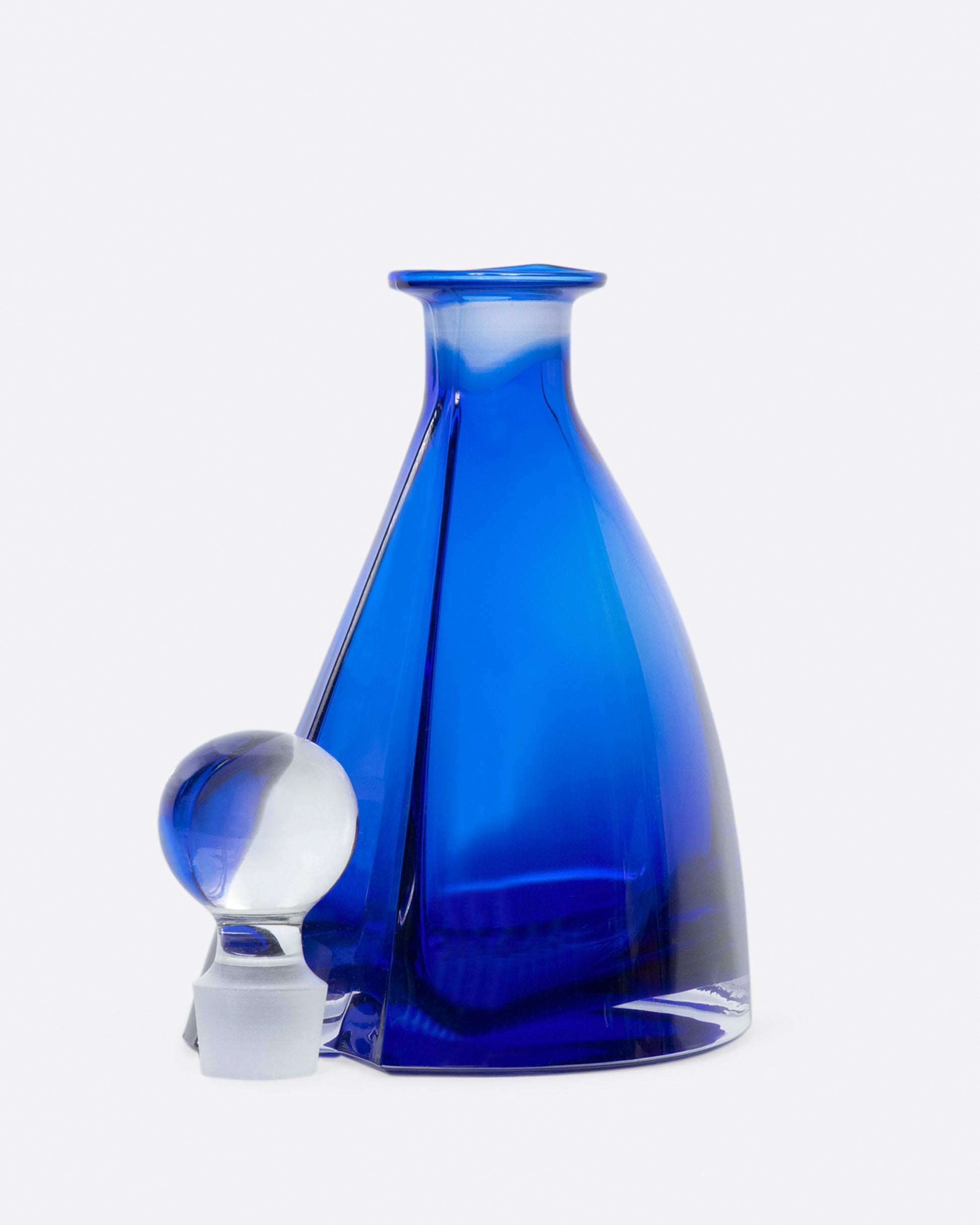 This heavy, heart-shaped bottle looks different from every angle.