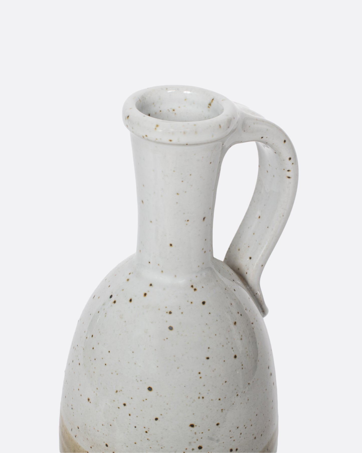 This vintage ceramic wine decanter is glazed with muted earth tones that make sharing a bottle of red an even cozier experience.