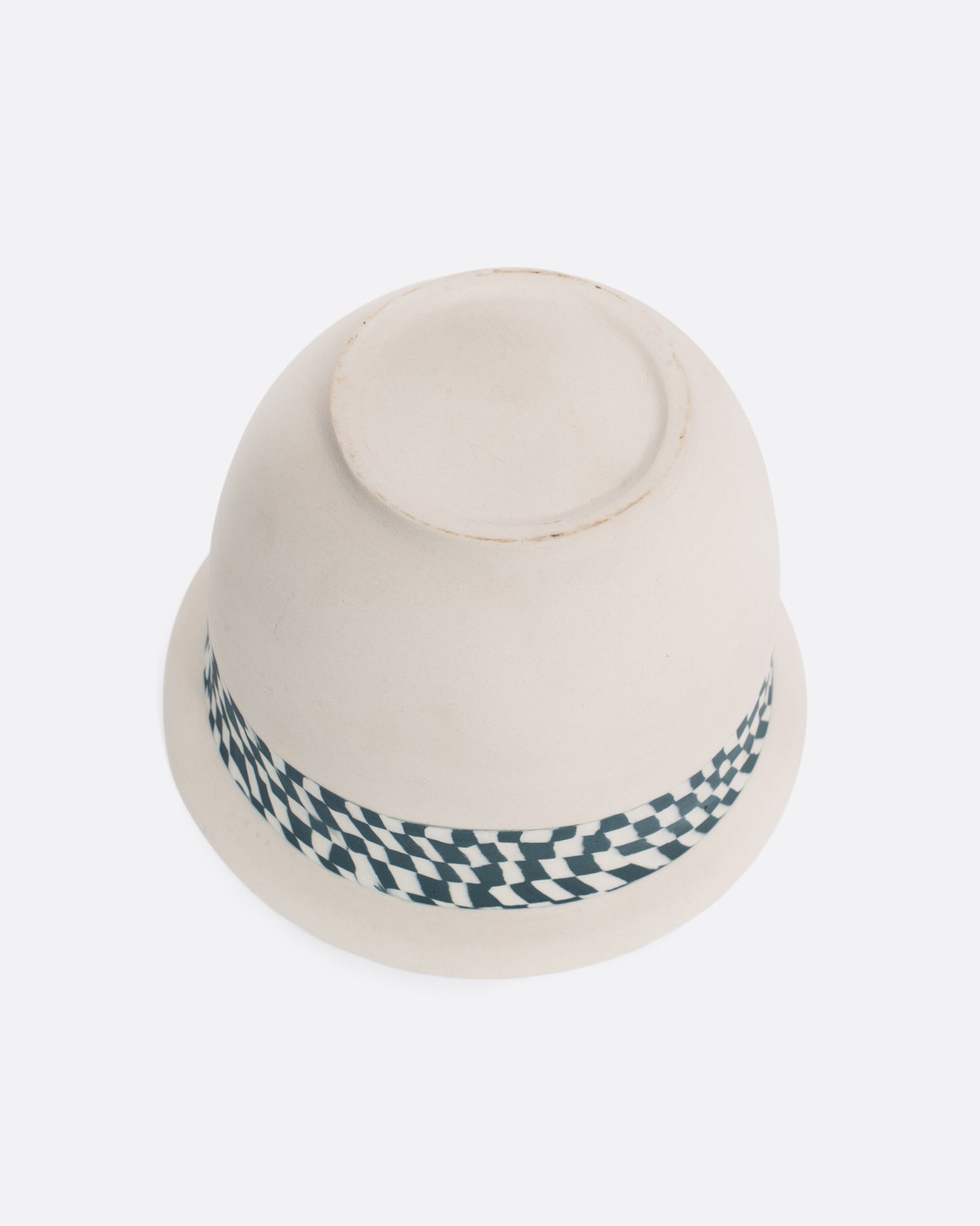 A vintage Nerikomi casserole dish with a blue and white checkered fish handle. The Japanese Nerikomi ceramic technique involves stacking and cutting colored pieces of clay, creating this beautiful checkered effect.