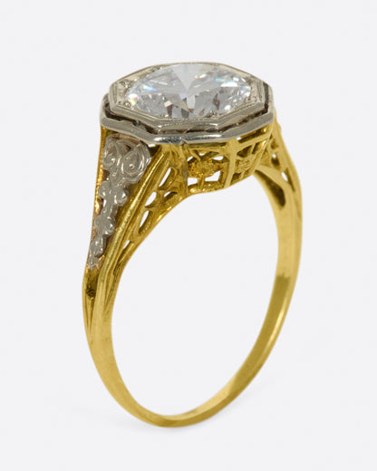 Vintage gold diamond ring, angled view showing the height of the octagonal setting and the filigree gallery