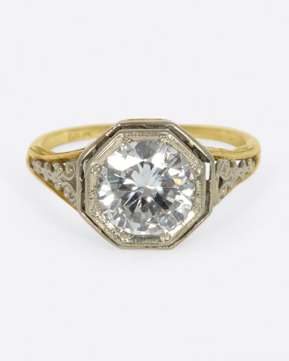 Vintage gold diamond ring, front view of the round diamond in its octagonal bezel