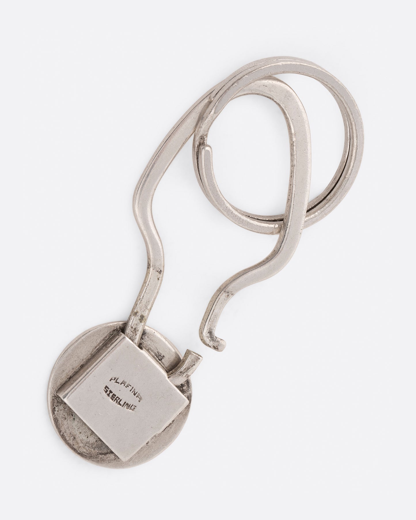 A Star of David key chain with crosshatching texture that offers both a key ring and a hook closure.