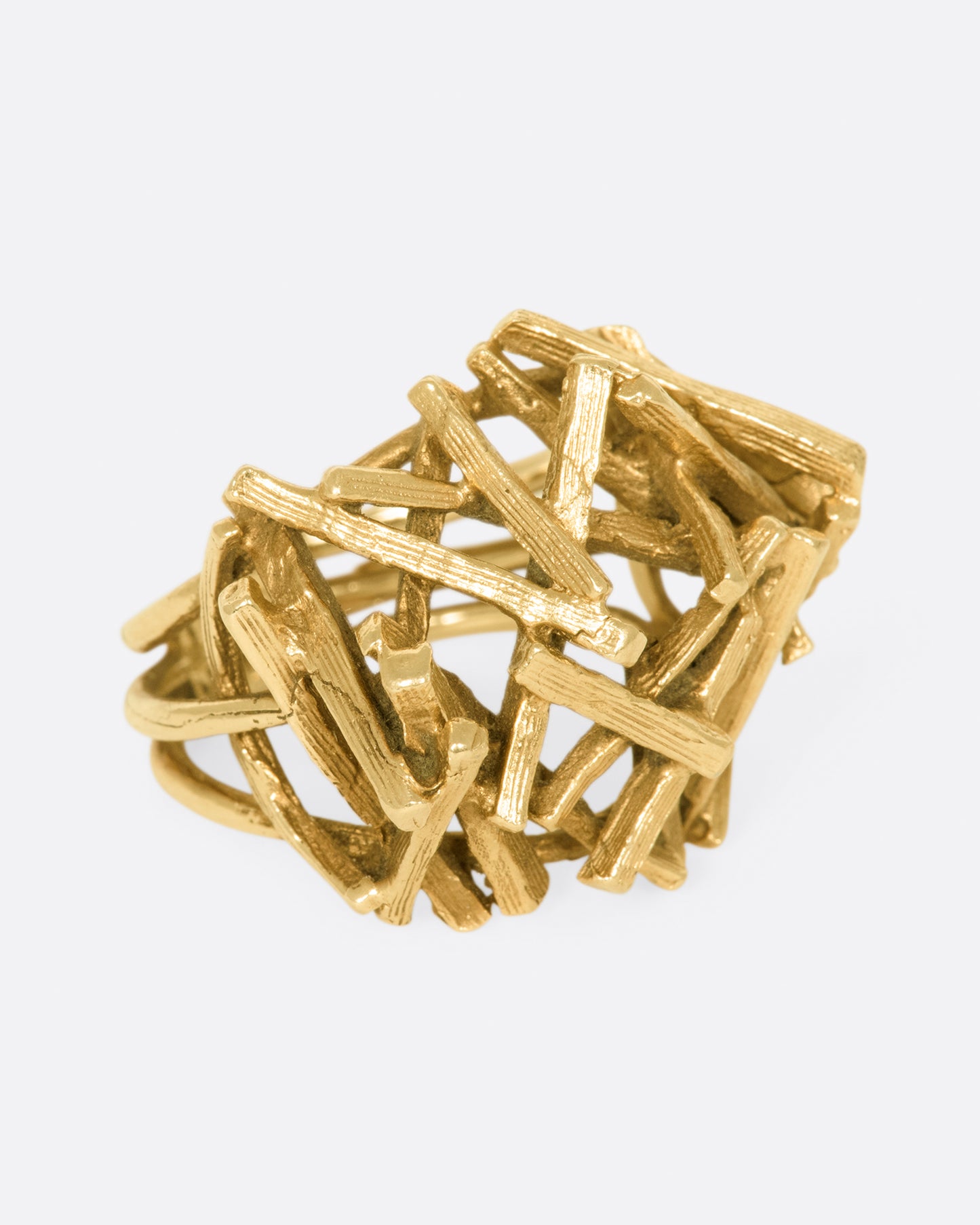 A vintage 15k gold pile of sticks ring that sits high above your finger in an incredible 3D dome