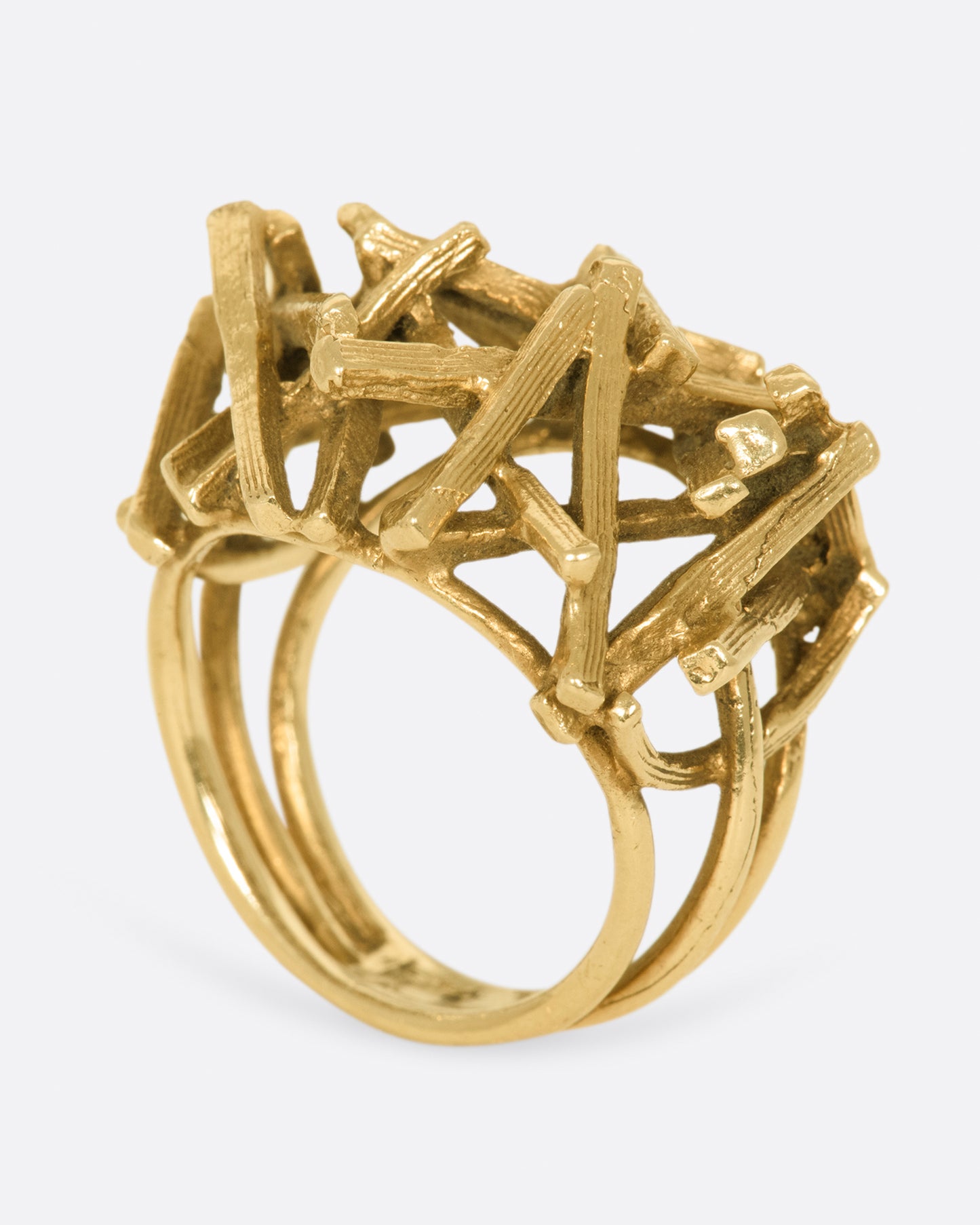 A vintage 15k gold pile of sticks ring that sits high above your finger in an incredible 3D dome