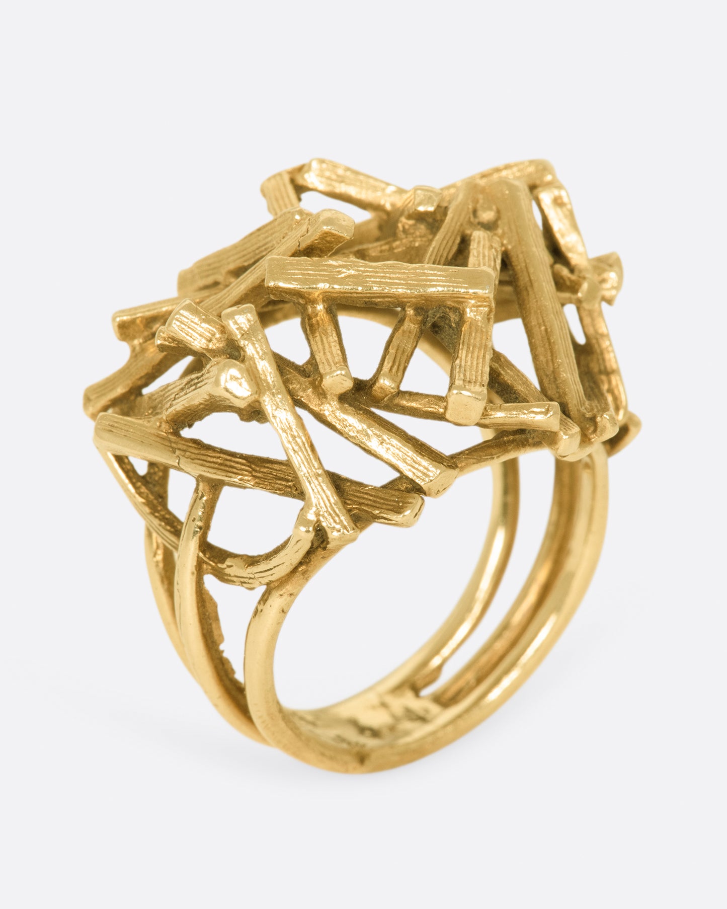 A vintage 15k gold pile of sticks ring that sits high above your finger in an incredible 3D dome