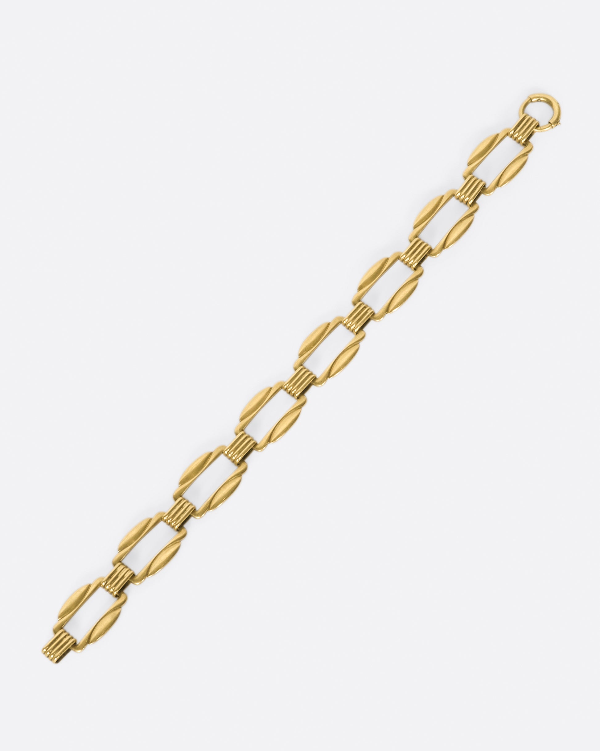 The clasp on this bracelet is hidden amongst its architectural links.