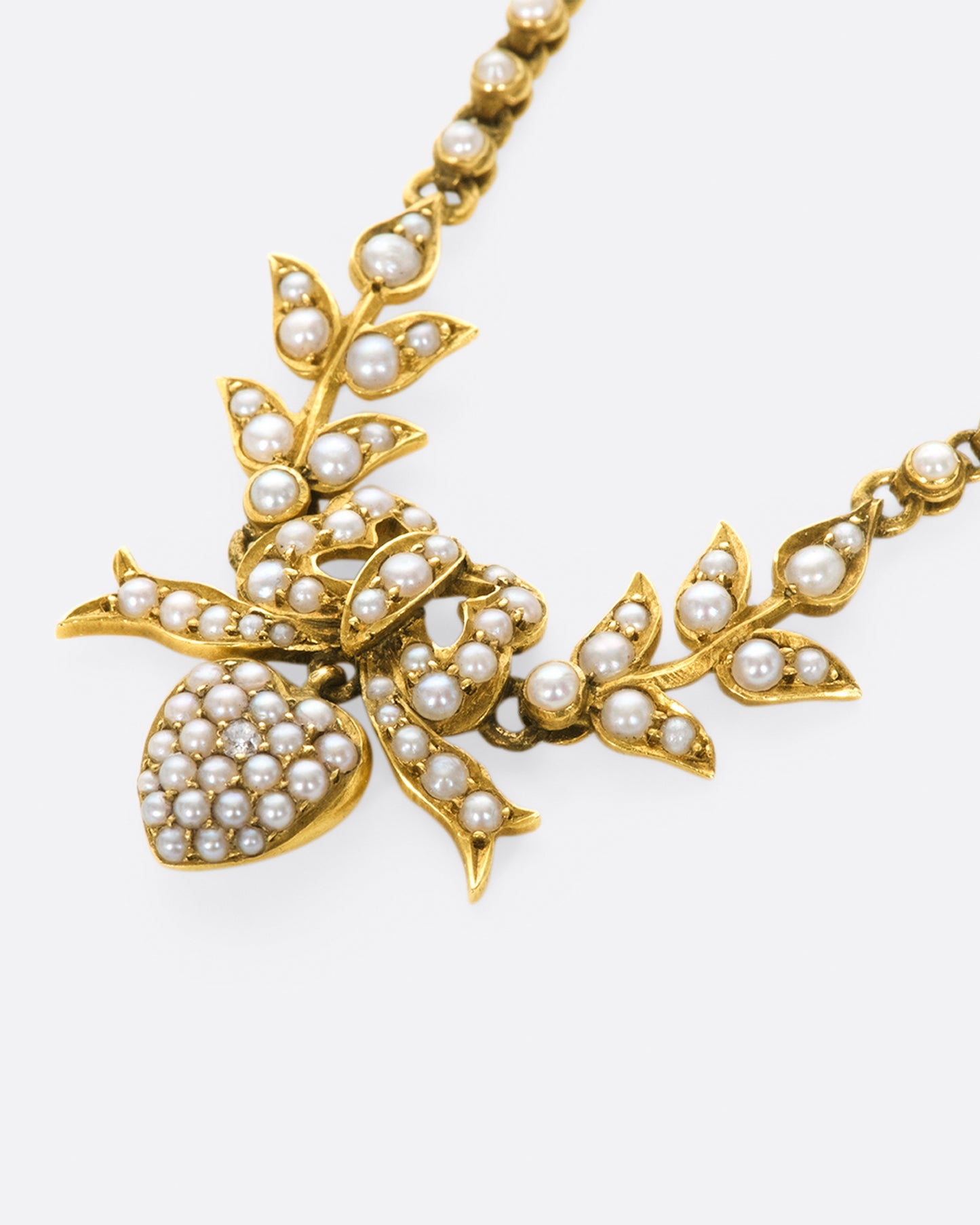 An English, 15k gold, belle epoque, turn of the century festoon necklace with natural seed pearls.